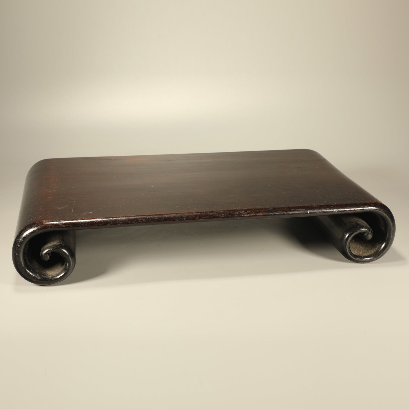 A RED SANDALWOOD LOW SCROLL TABLE (1 of 7)