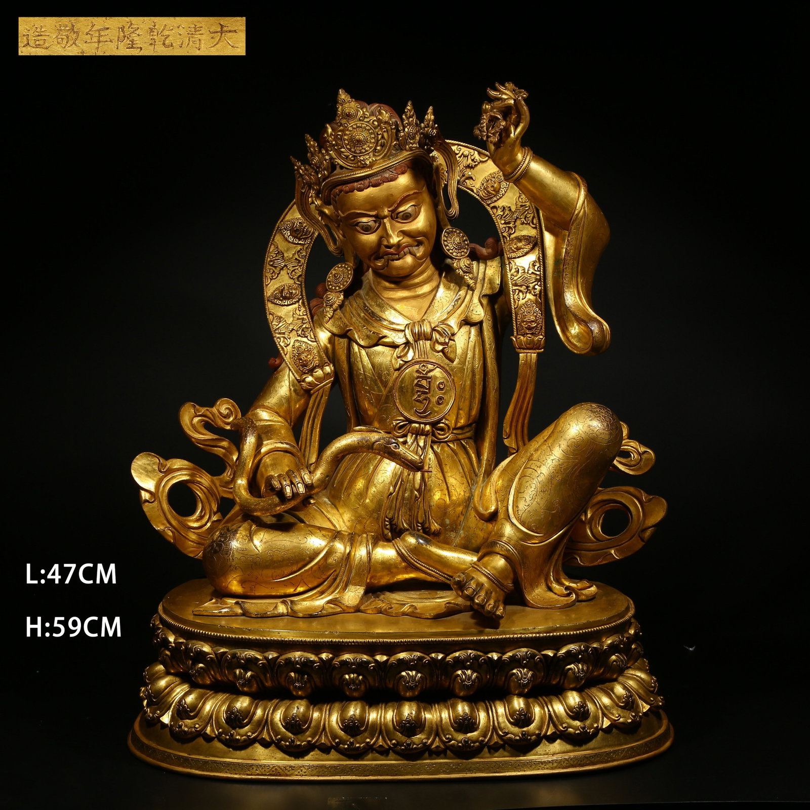 A GILT BRONZE STATUE OF A MAHASIDDHA (GREAT ACCOMPLISHED ONE): Gilt Bronze Statue of a Mahasiddha (Great Accomplished One)
