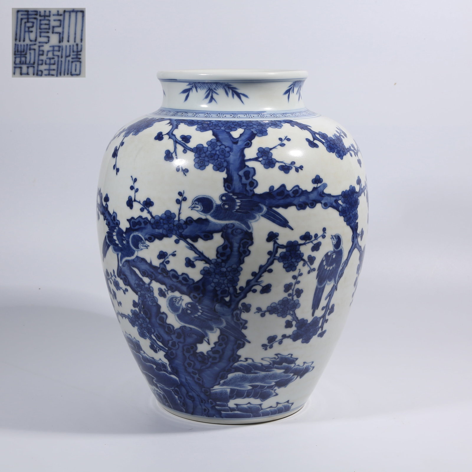 A BLUE-AND-WHITE JAR WITH FLOWER AND BIRD PATTERN: Blue-and-White Jar with Flower and Bird Pattern