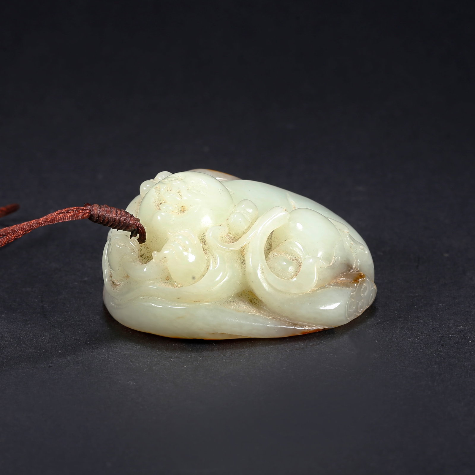 A HETIAN JADE CHILD-SHAPED HANDLE: Hetian Jade Child-Shaped Handle