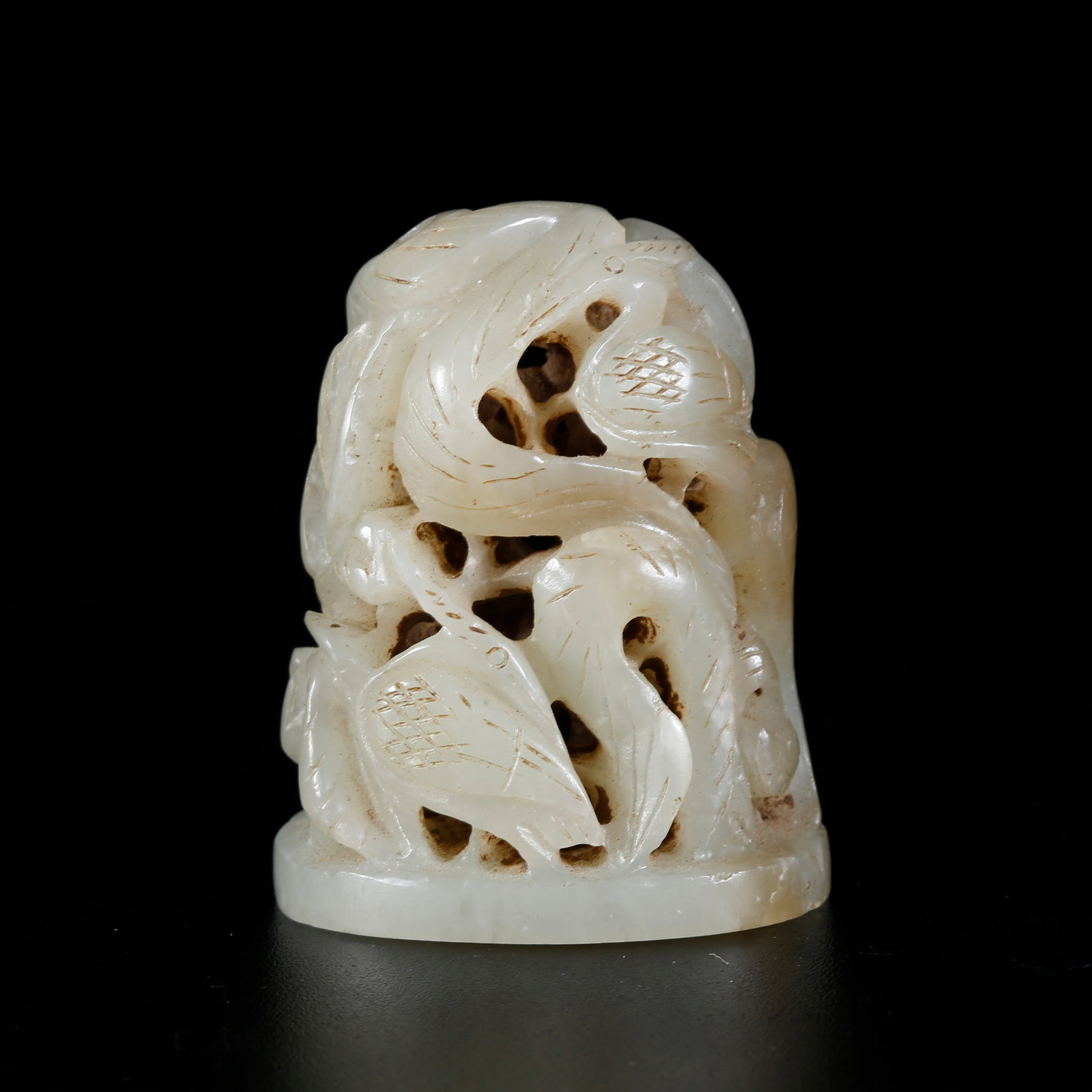 A HETIAN JADE CARVED HAT FINIAL: Hetian Jade Carved Hat Finial