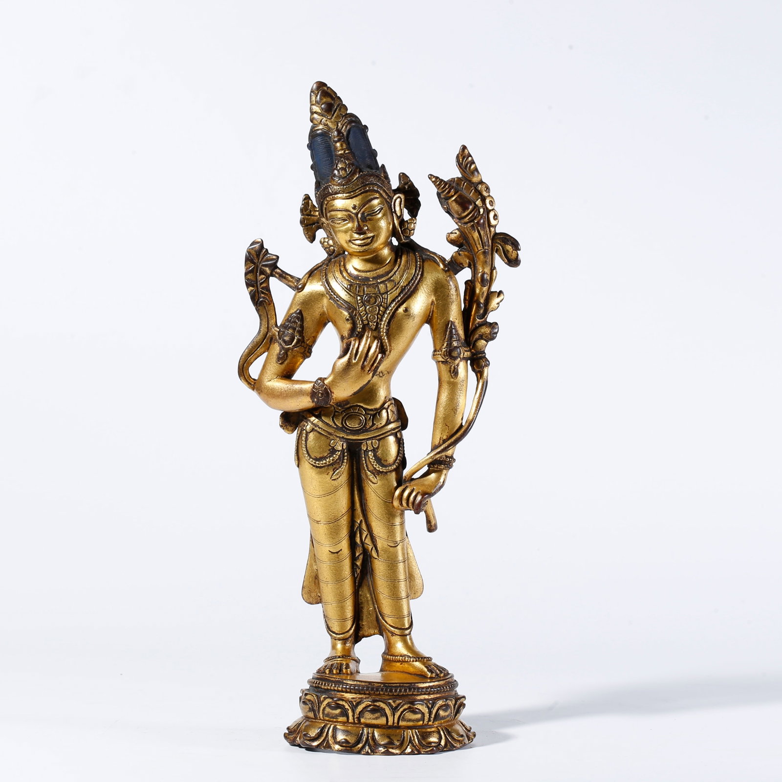 A GILDED BRONZE STANDING BUDDHA STATUE (1 of 9)