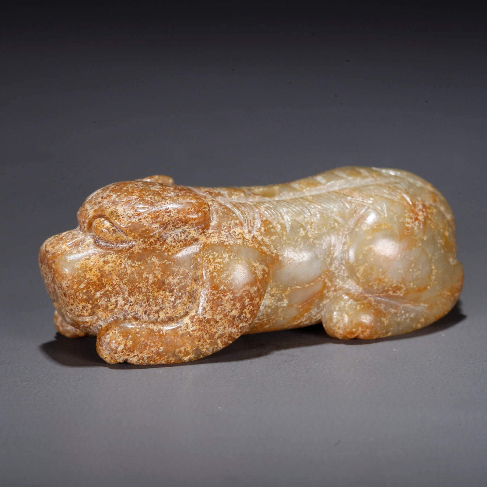 A CARVED HETIAN JADE BEAST-SHAPED PENDANT (1 of 10)