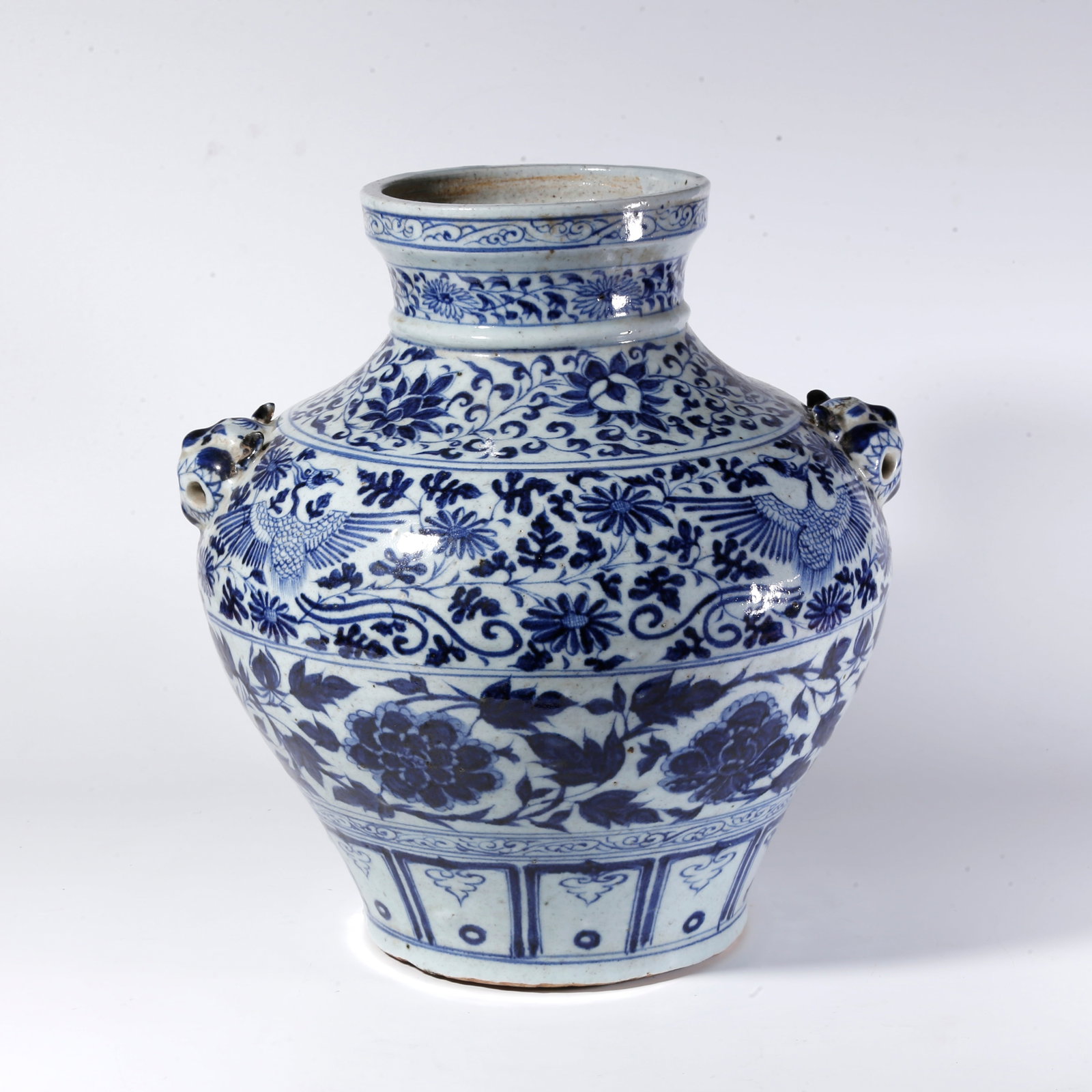 A BLUE-AND-WHITE PHOENIX THROUGH FLOWERS DOUBLE-HANDLED ZUN: Blue-and-White Phoenix Through Flowers Double-Handled Zun
