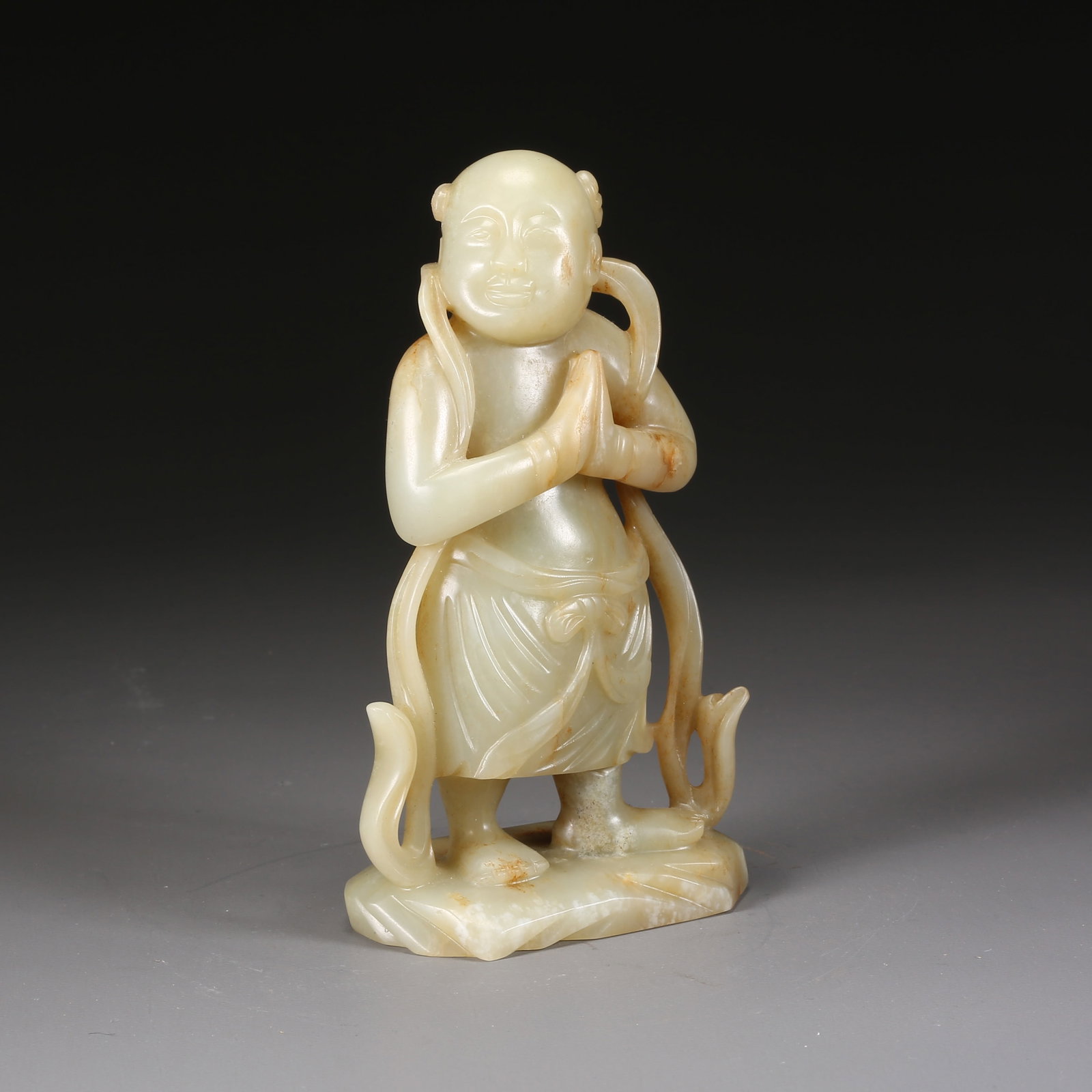 A HETIAN JADE SUDHANA (CHILD OF GOOD FORTUNE) FIGURE: Hetian jade Sudhana (Child of Good Fortune) figure