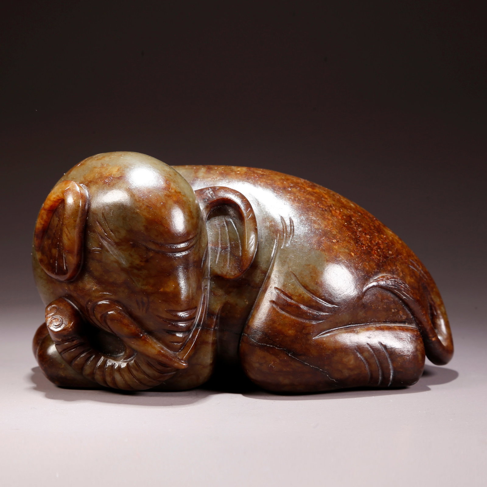 A HETIAN JADE "PEACE AND AUSPICIOUS ELEPHANT" FIGURINE: Hetian Jade "Peace and Auspicious Elephant" Figurine