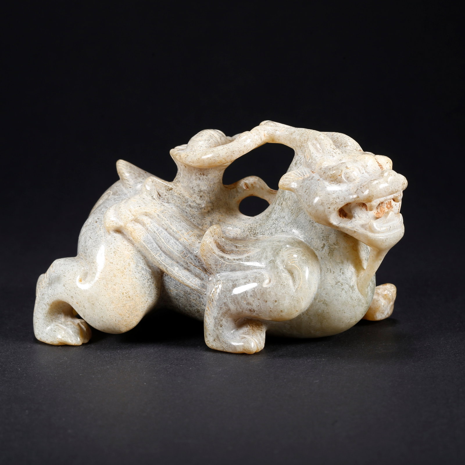 A HETIAN JADE CHI-TIGER FIGURINE (1 of 9)