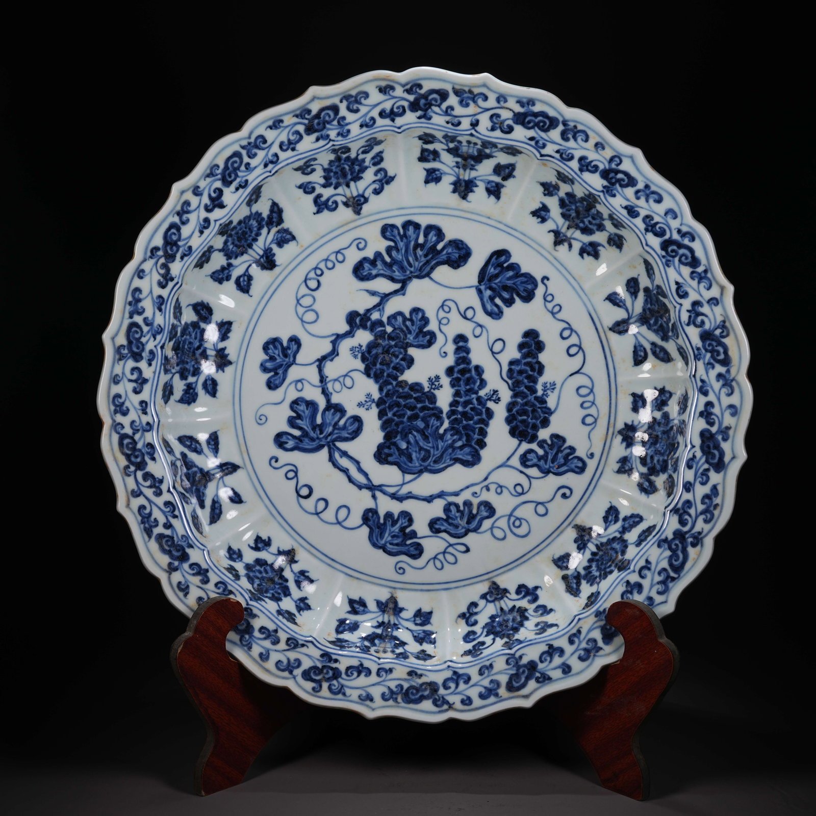 A BLUE-AND-WHITE DISH WITH AUSPICIOUS FRUIT MOTIFS AND FOLIATE RIM: Blue-and-White Dish with Auspicious Fruit Motifs and Foliate Rim