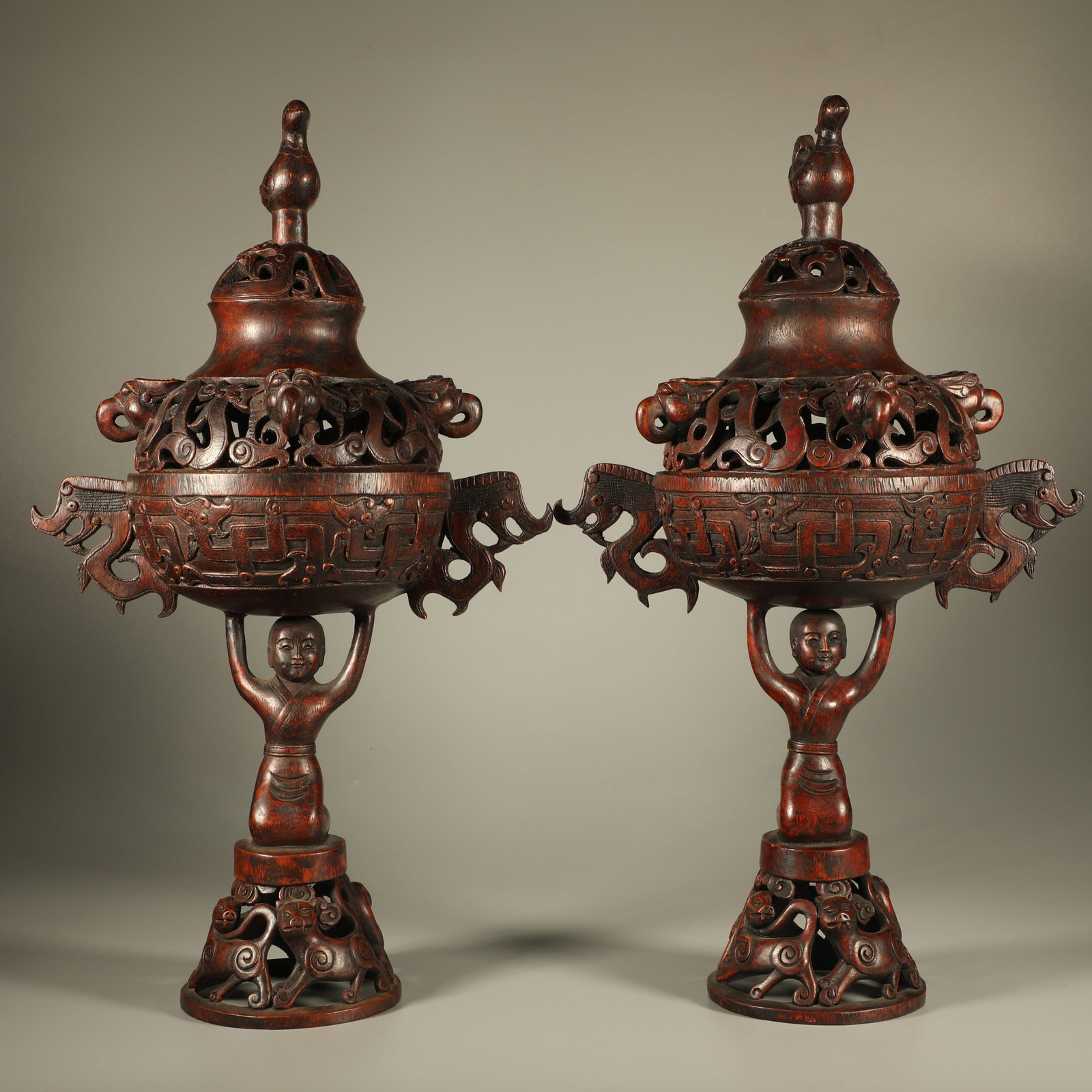 A PAIR OF AGARWOOD INCENSE BURNERS CARVED WITH DRAGON AND AUSPICIOUS BEAST MOTIFS: Pair of Agarwood Incense Burners Carved with Dragon and Auspicious Beast Motifs