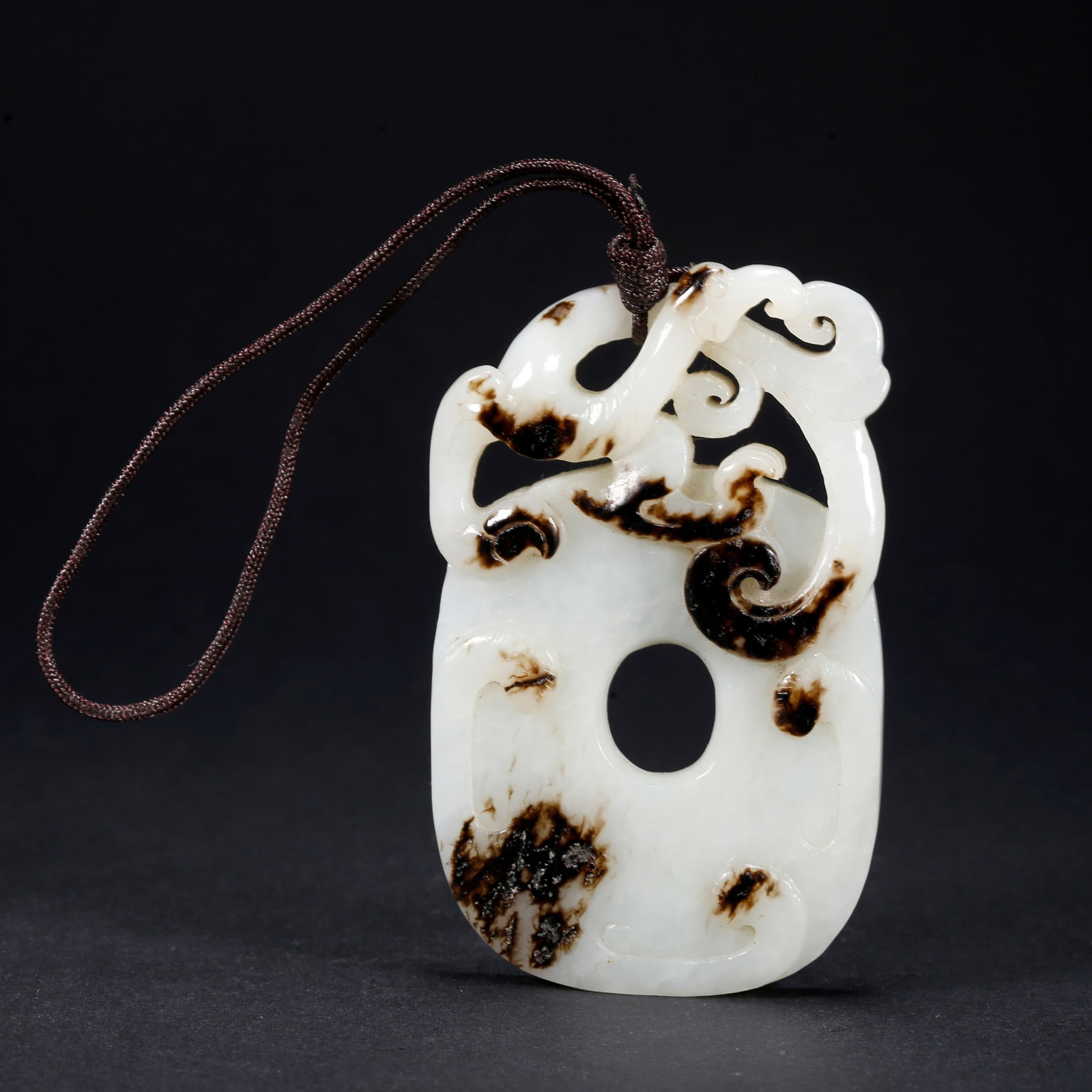 A HETIAN JADE PHOENIX MOTIF PENDANT (1 of 10)