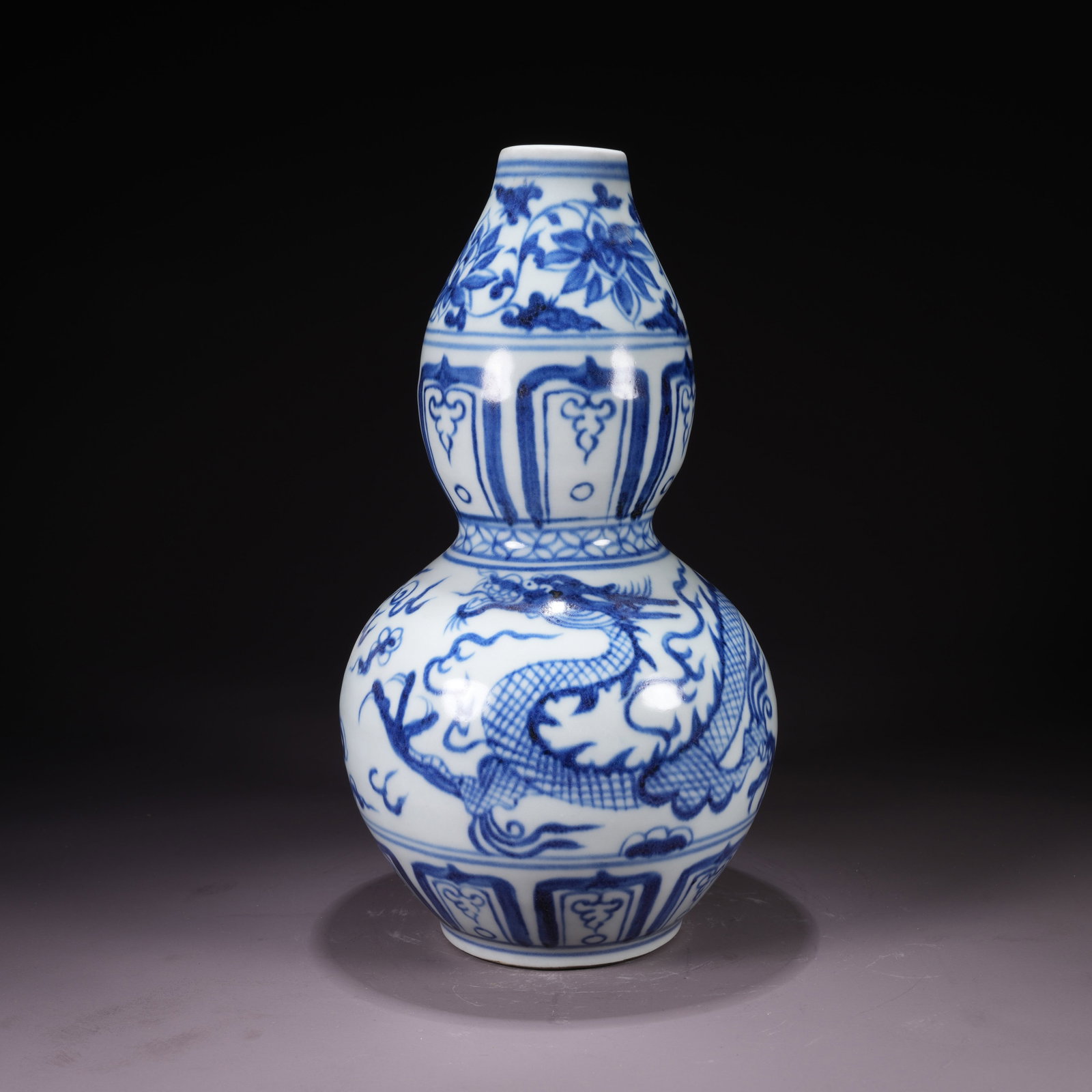 A BLUE-AND-WHITE DOUBLE-GOURD VASE WITH CLOUD AND DRAGON PURSUING PEARL MOTIF (1 of 9)