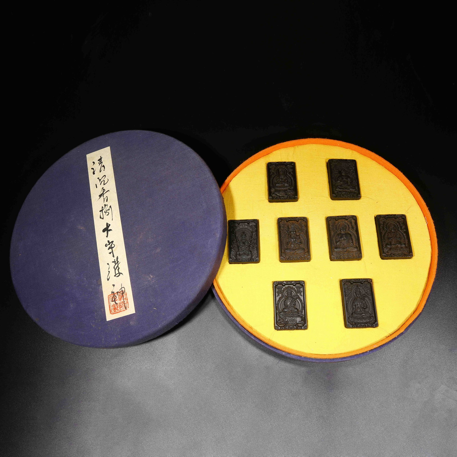 A SET OF AGARWOOD BUDDHA PLAQUES (1 of 10)