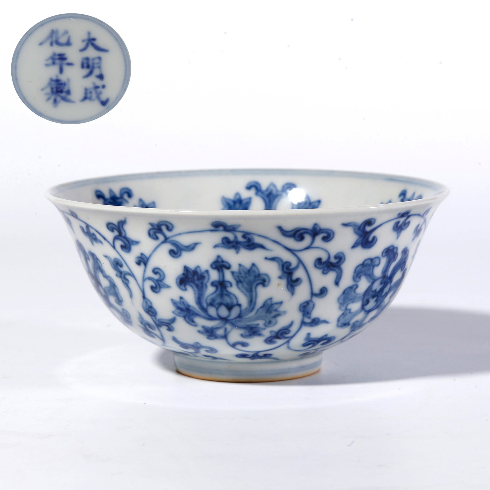 A BLUE-AND-WHITE FLORAL SCROLL BOWL: Blue-and-White Floral Scroll Bowl