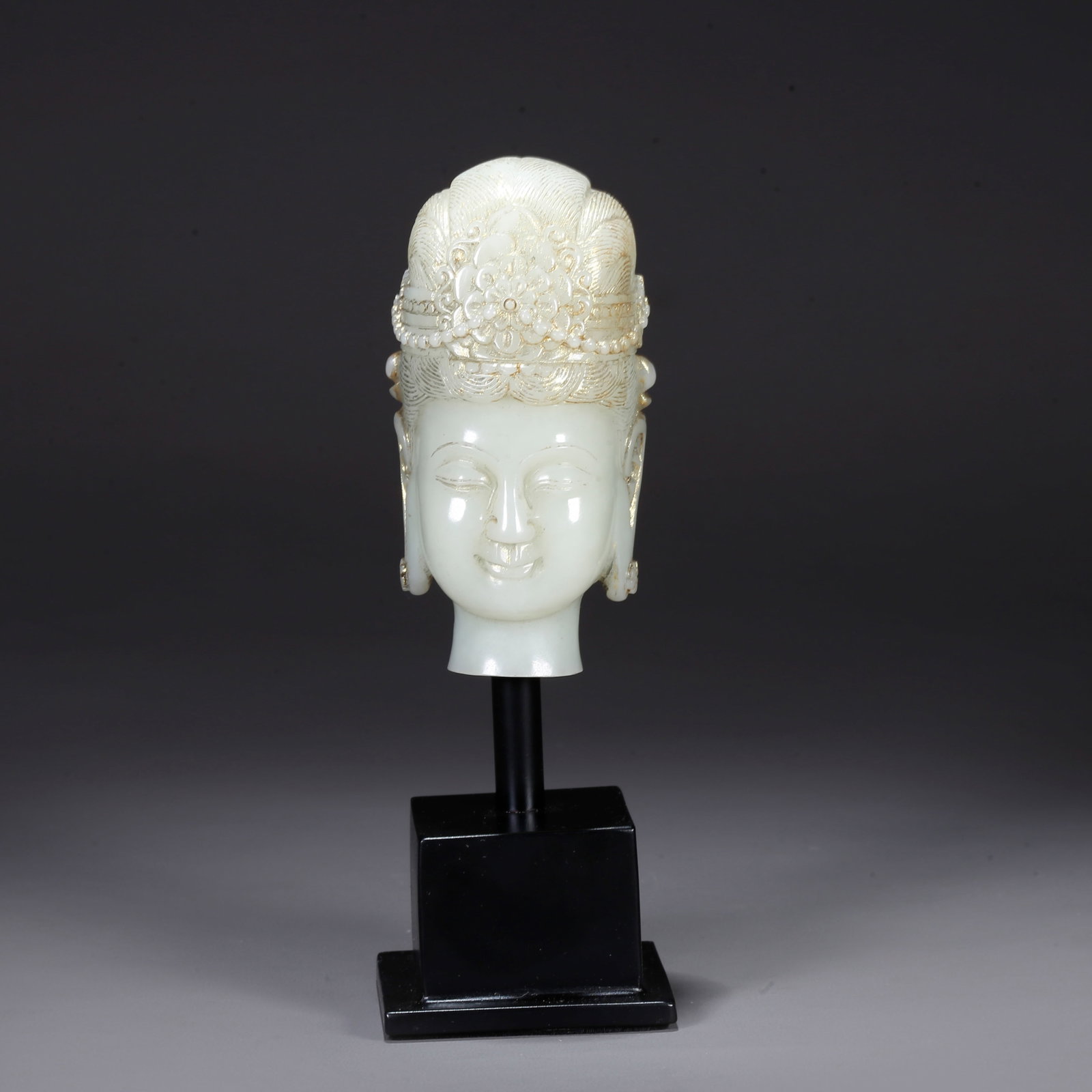 A CARVED HETIAN JADE BUDDHA HEAD (1 of 9)