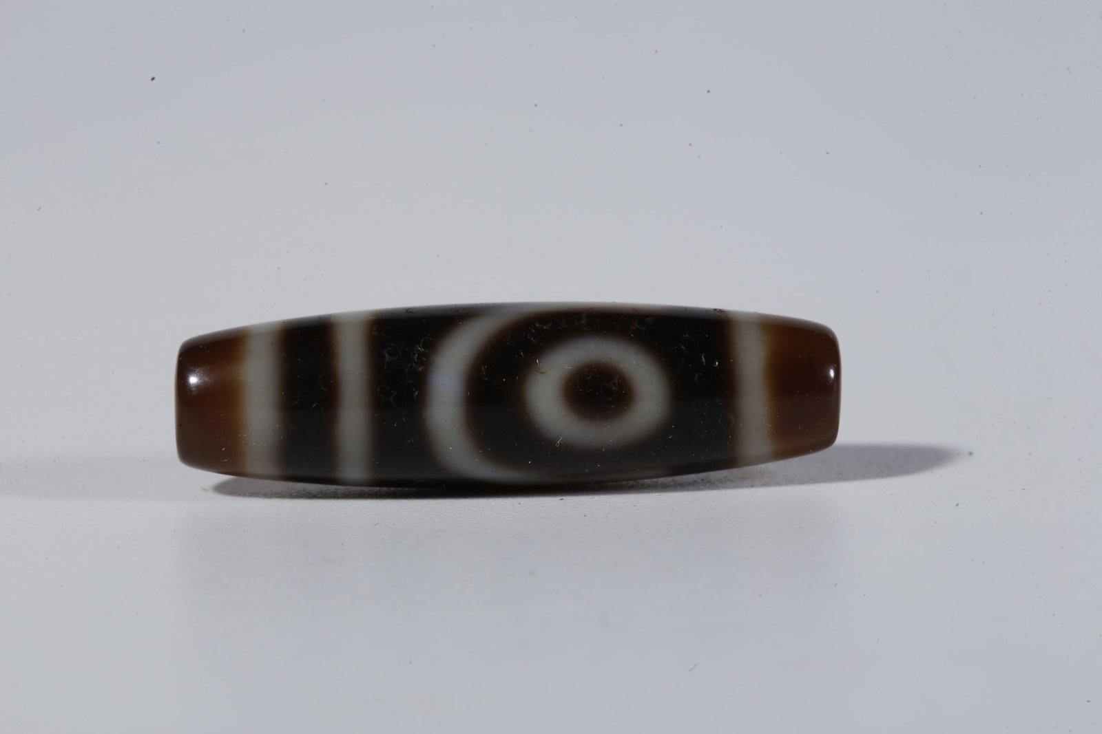 A TWO-EYED DZI BEAD - 2
