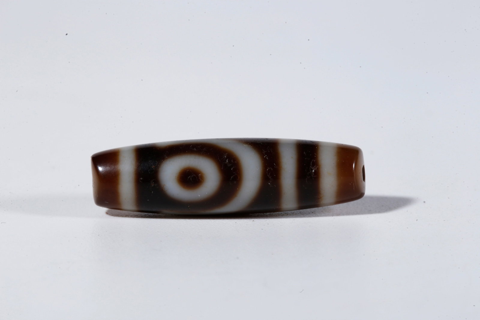 A TWO-EYED DZI BEAD - 4