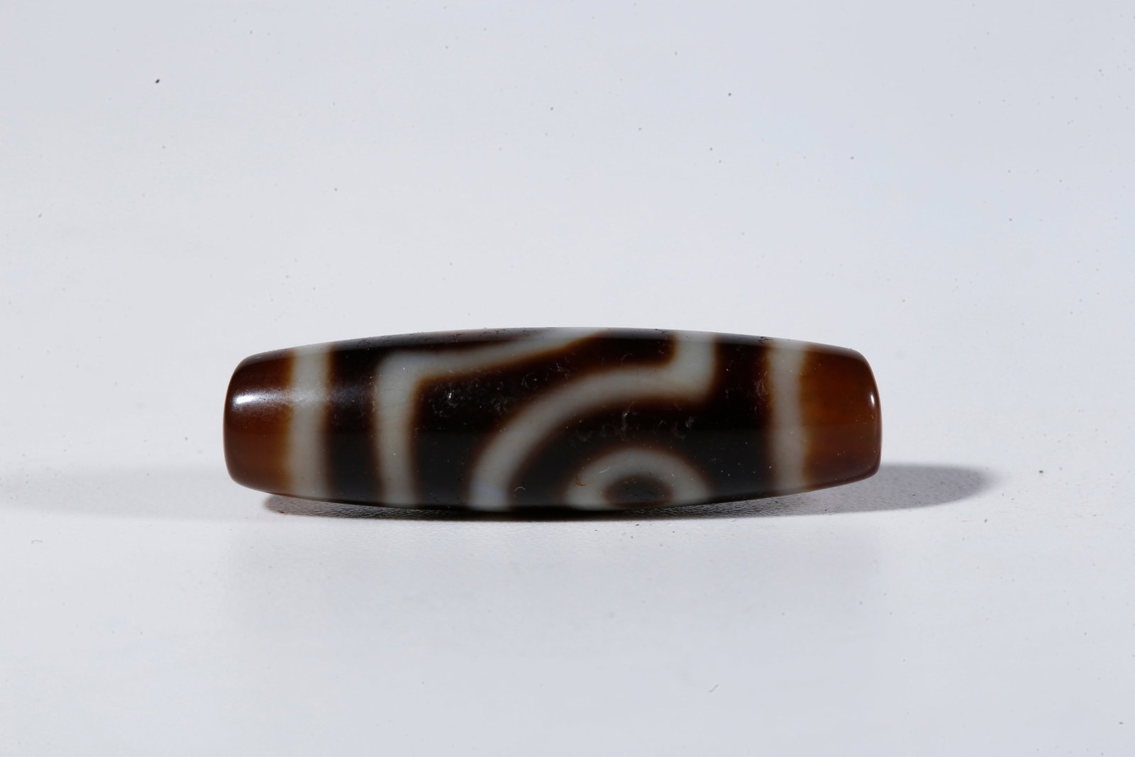 A TWO-EYED DZI BEAD - 5