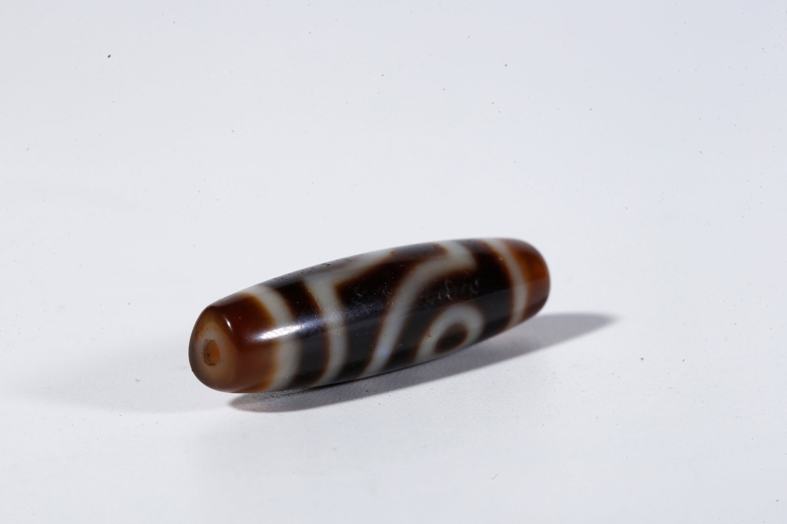 A TWO-EYED DZI BEAD - 6