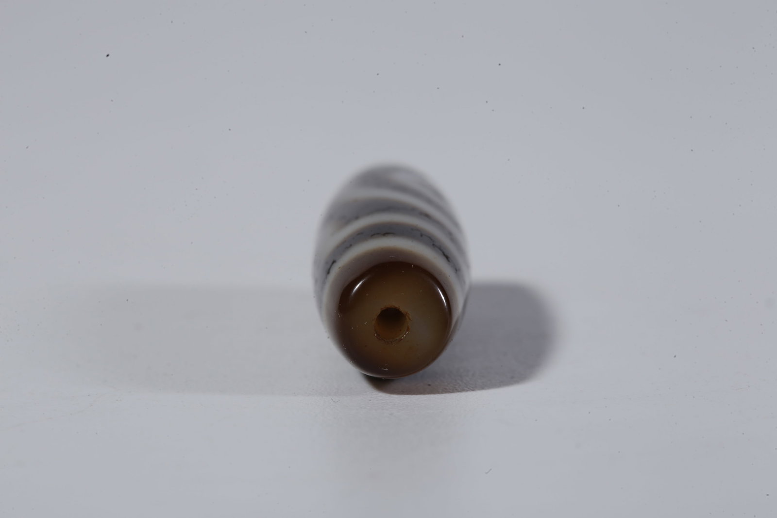 A TWO-EYED DZI BEAD - 9