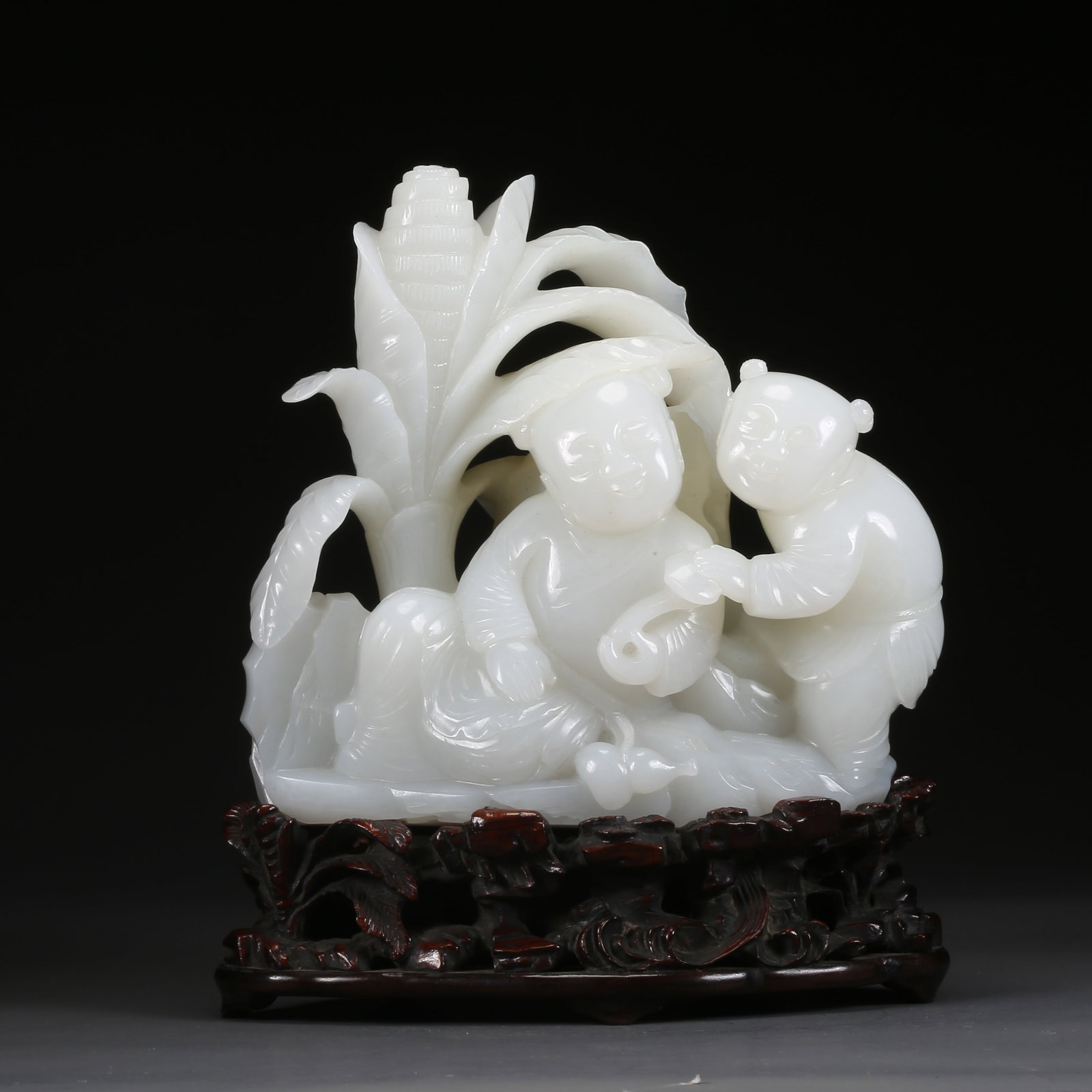 A HETIAN WHITE JADE CHILD FIGURE ORNAMENT: Hetian white jade child figure ornament