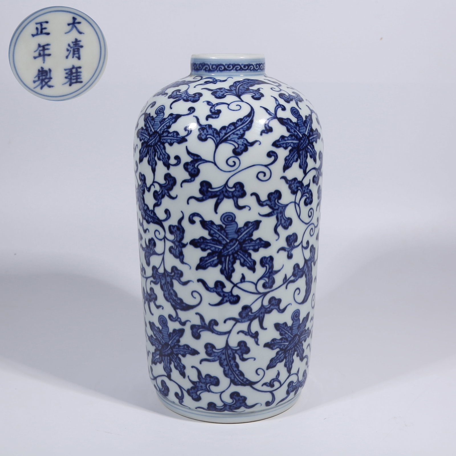 A BLUE-AND-WHITE LANTERN-SHAPED VASE WITH CONTINUOUS FLORAL PATTERN: Blue-and-White Lantern-Shaped Vase with Continuous Floral Pattern