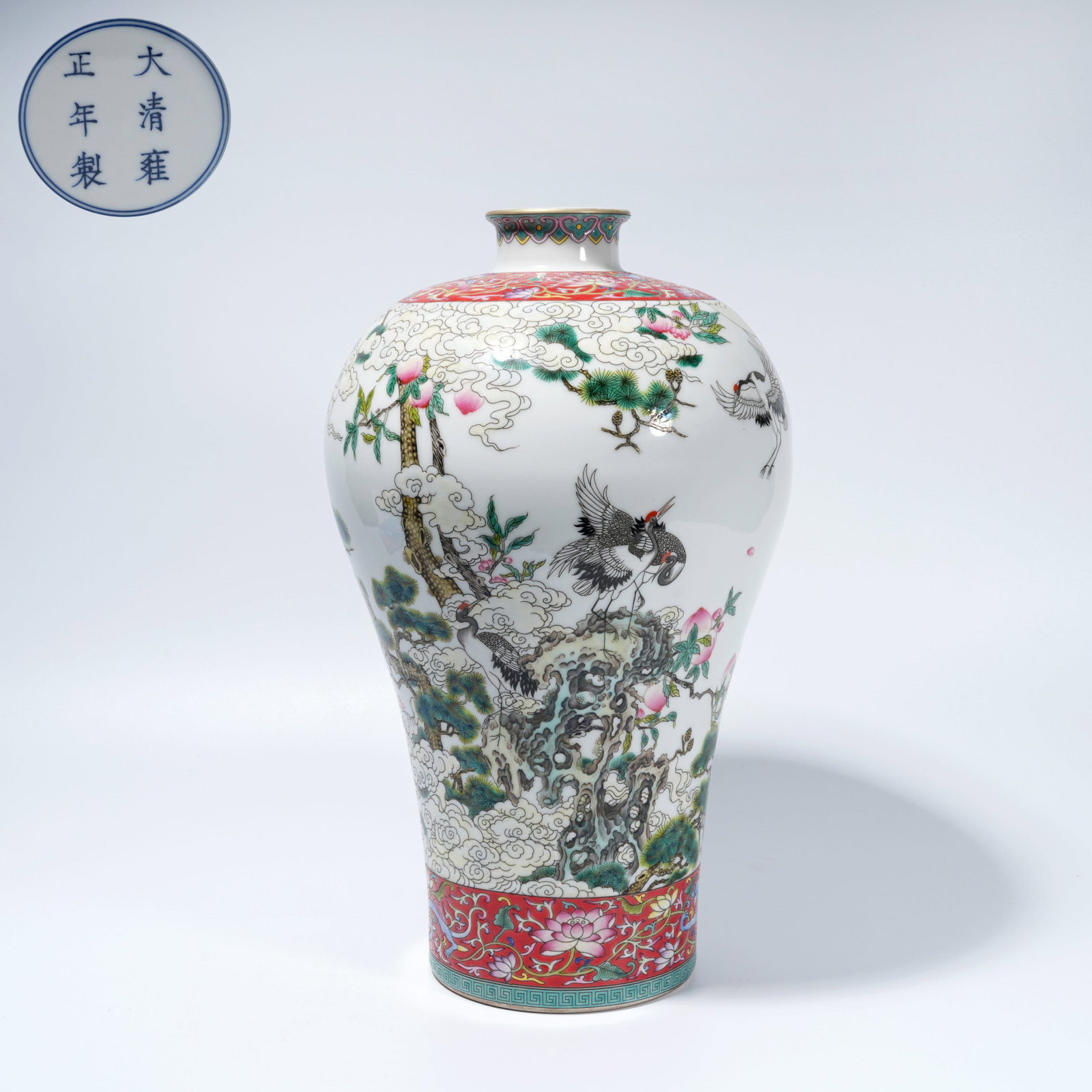 A FAMILLE-ROSE PLUM VASE WITH PINE-AND-CRANE MOTIF: Famille-Rose Plum Vase with Pine-and-Crane Motif