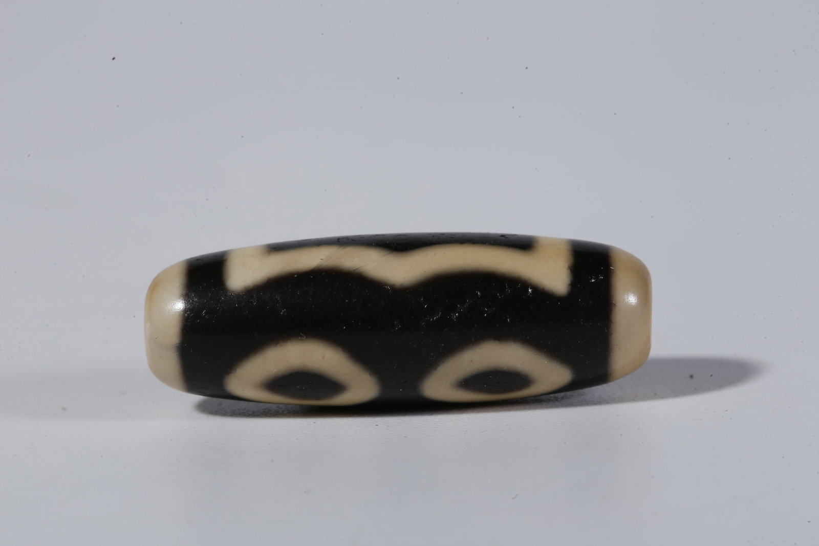 A THREE-EYED DZI BEAD - 3