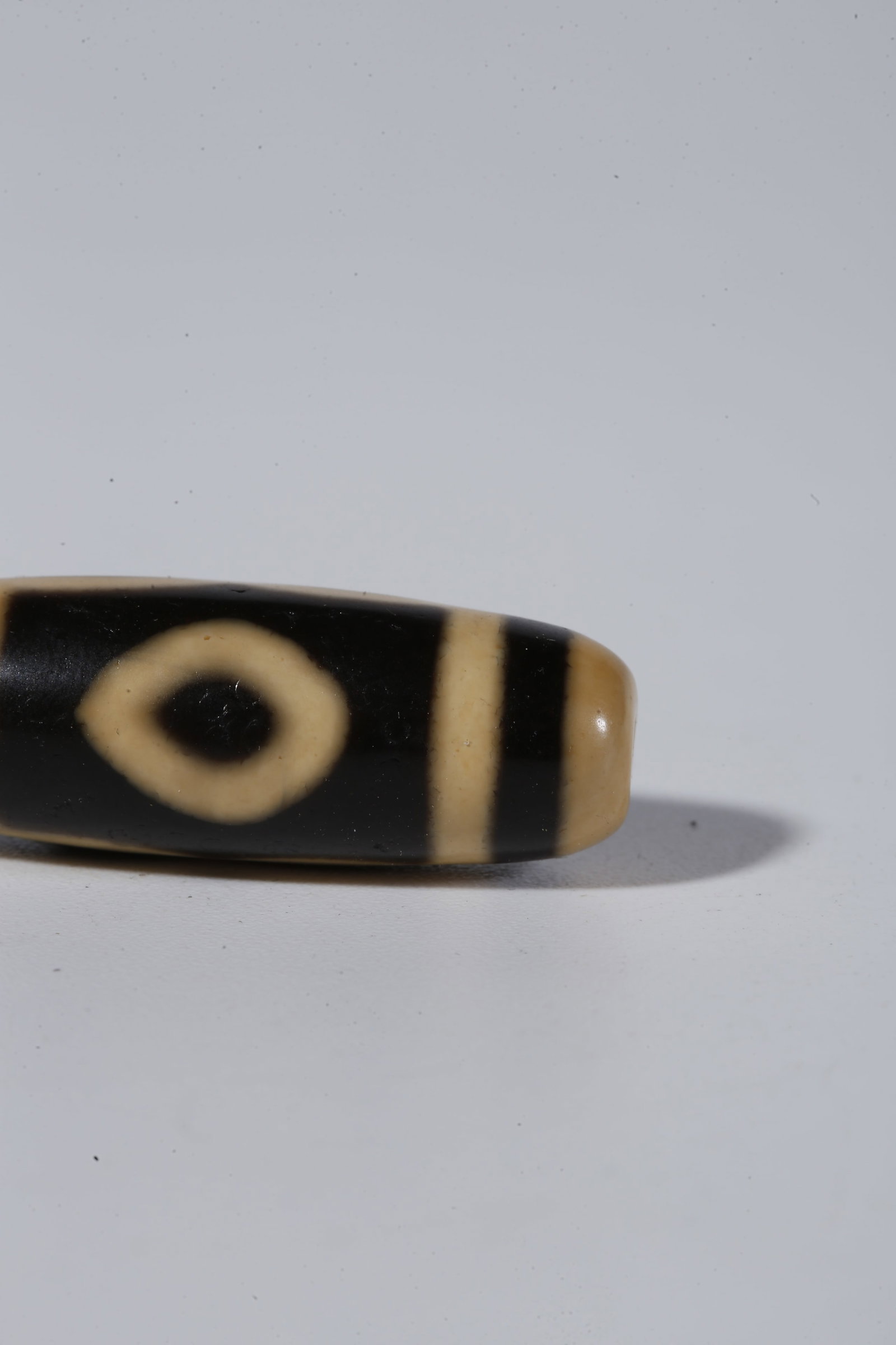 A THREE-EYED DZI BEAD - 6