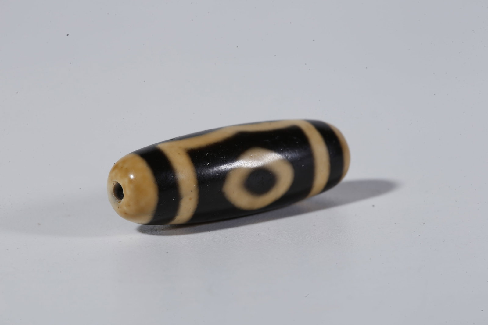 A THREE-EYED DZI BEAD - 7