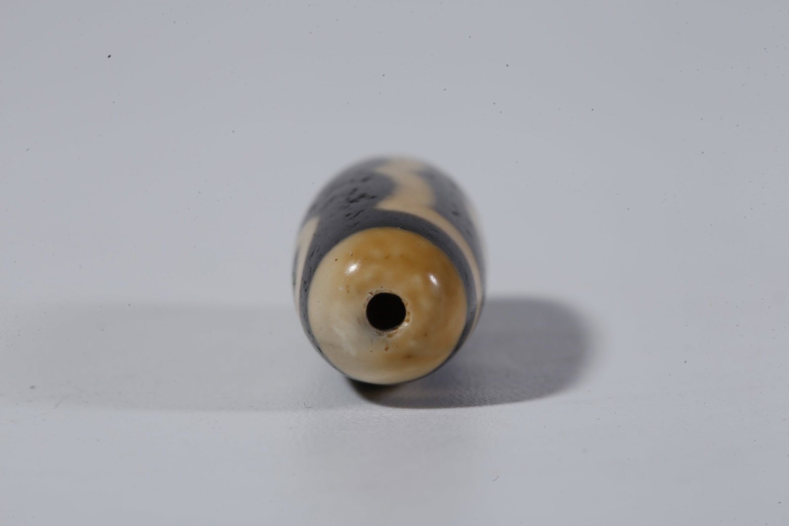 A THREE-EYED DZI BEAD - 8