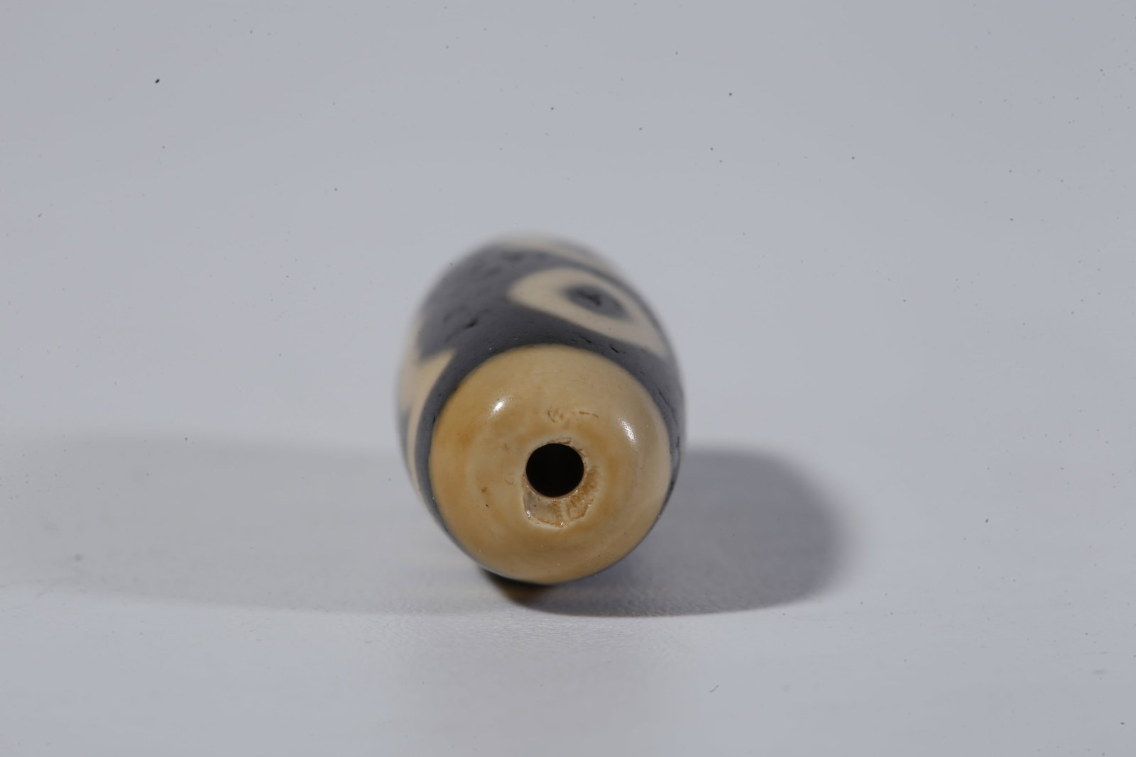 A THREE-EYED DZI BEAD - 9