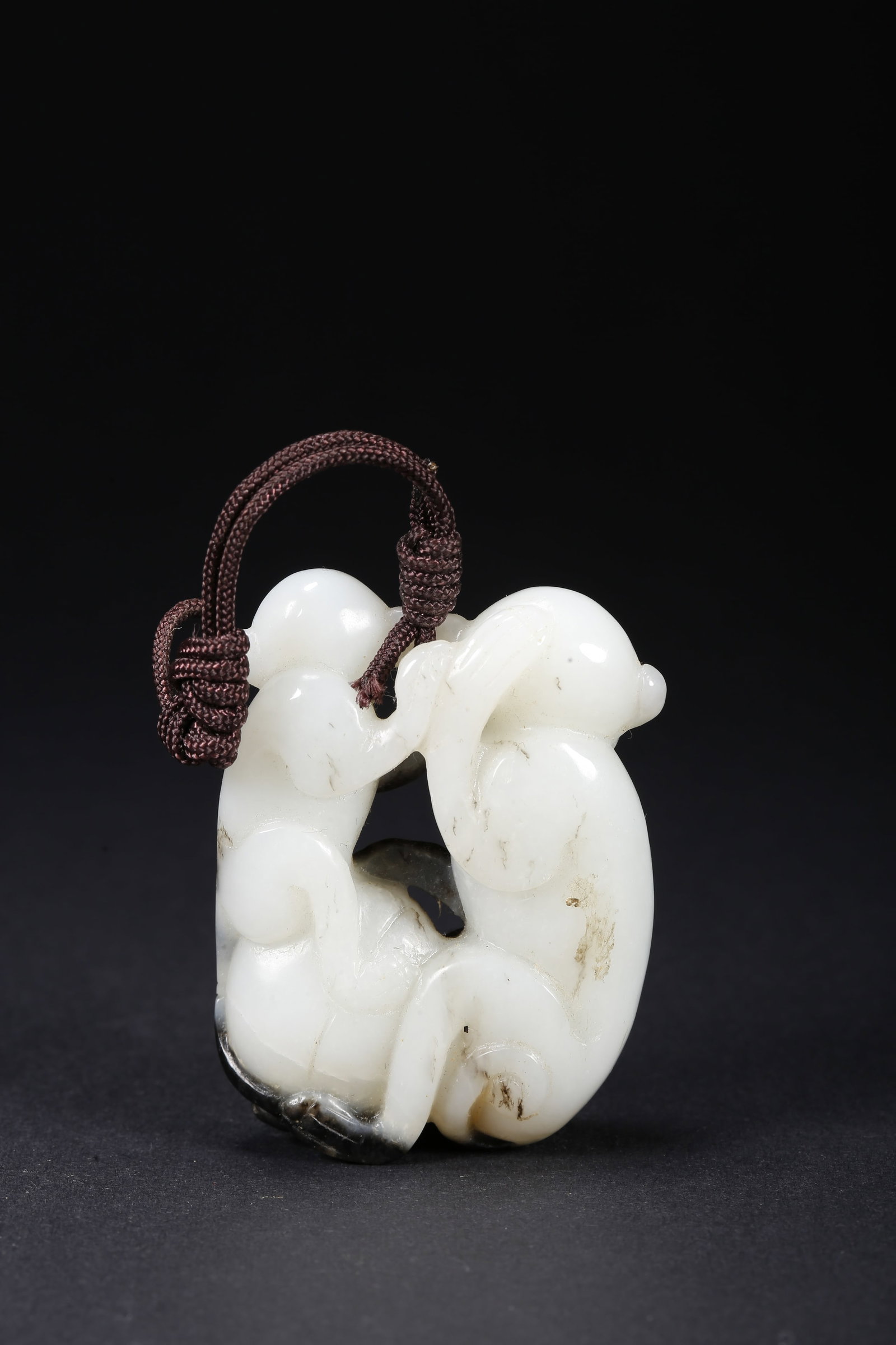 A HETIAN JADE MONKEY-SHAPED HANDLE - 10