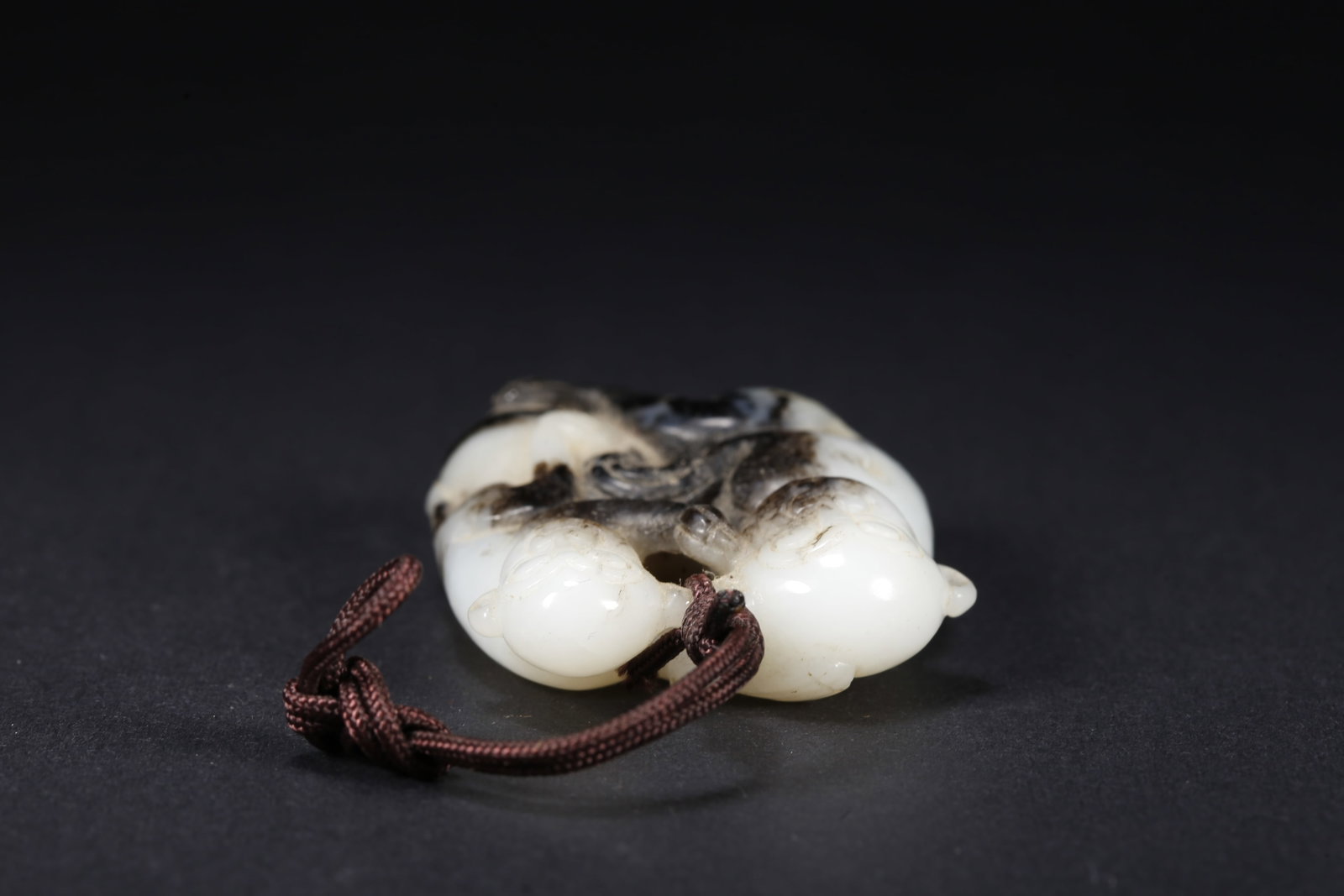 A HETIAN JADE MONKEY-SHAPED HANDLE - 6