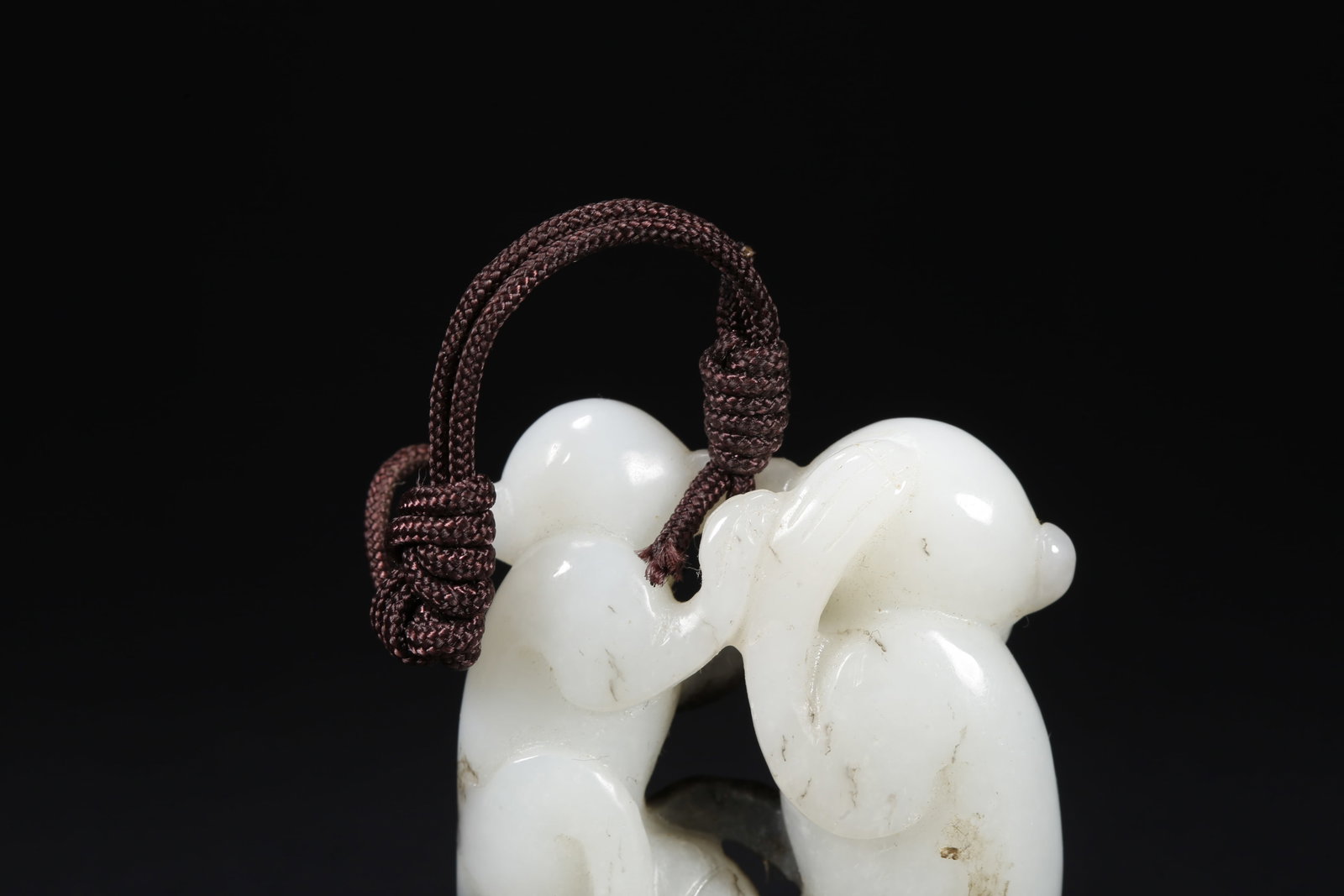 A HETIAN JADE MONKEY-SHAPED HANDLE - 8