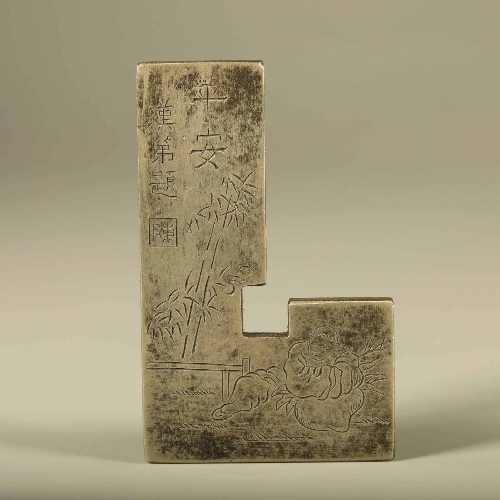 A WHITE BRONZE SEAL RULER CARVED WITH FIGURES (1 of 7)