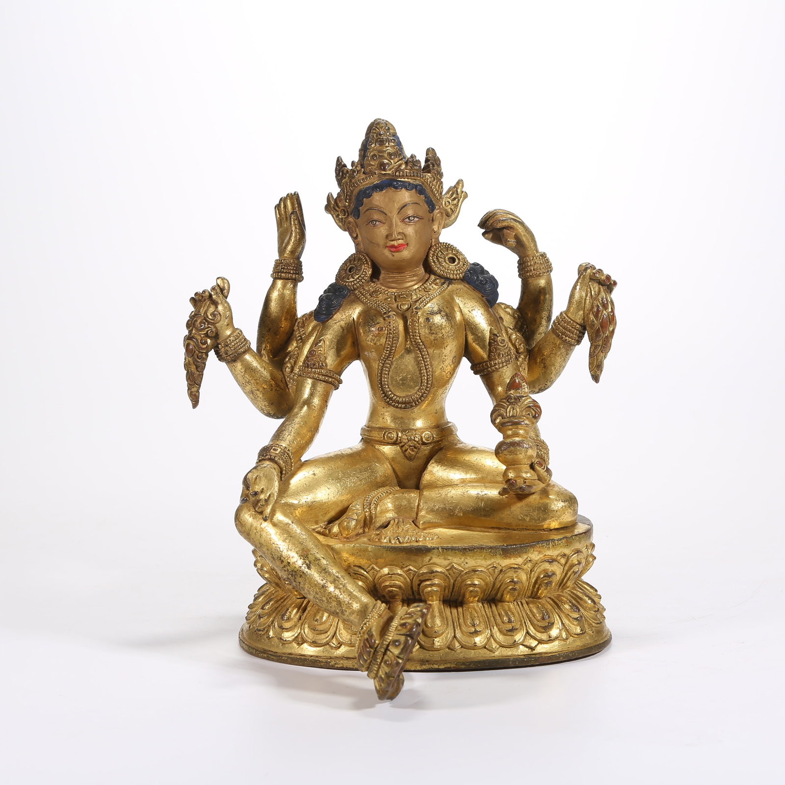 A GILT-BRONZE STATUE OF VASUDHARA (GODDESS OF WEALTH AND PROSPERITY): Gilt-Bronze Statue of Vasudhara (Goddess of Wealth and Prosperity)