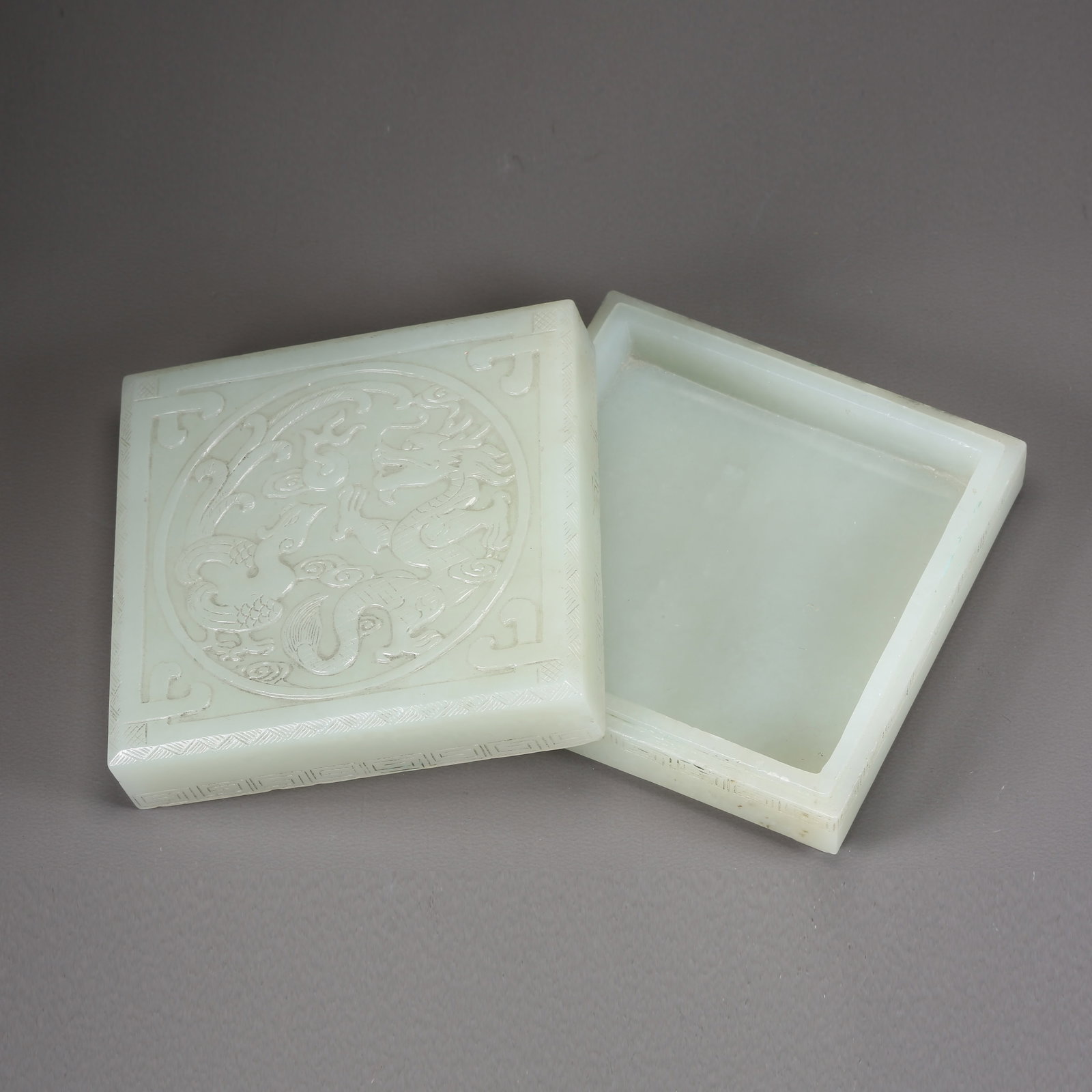 A HETIAN JADE SQUARE COVERED BOX WITH DRAGON-AND-PHOENIX MOTIF (1 of 10)