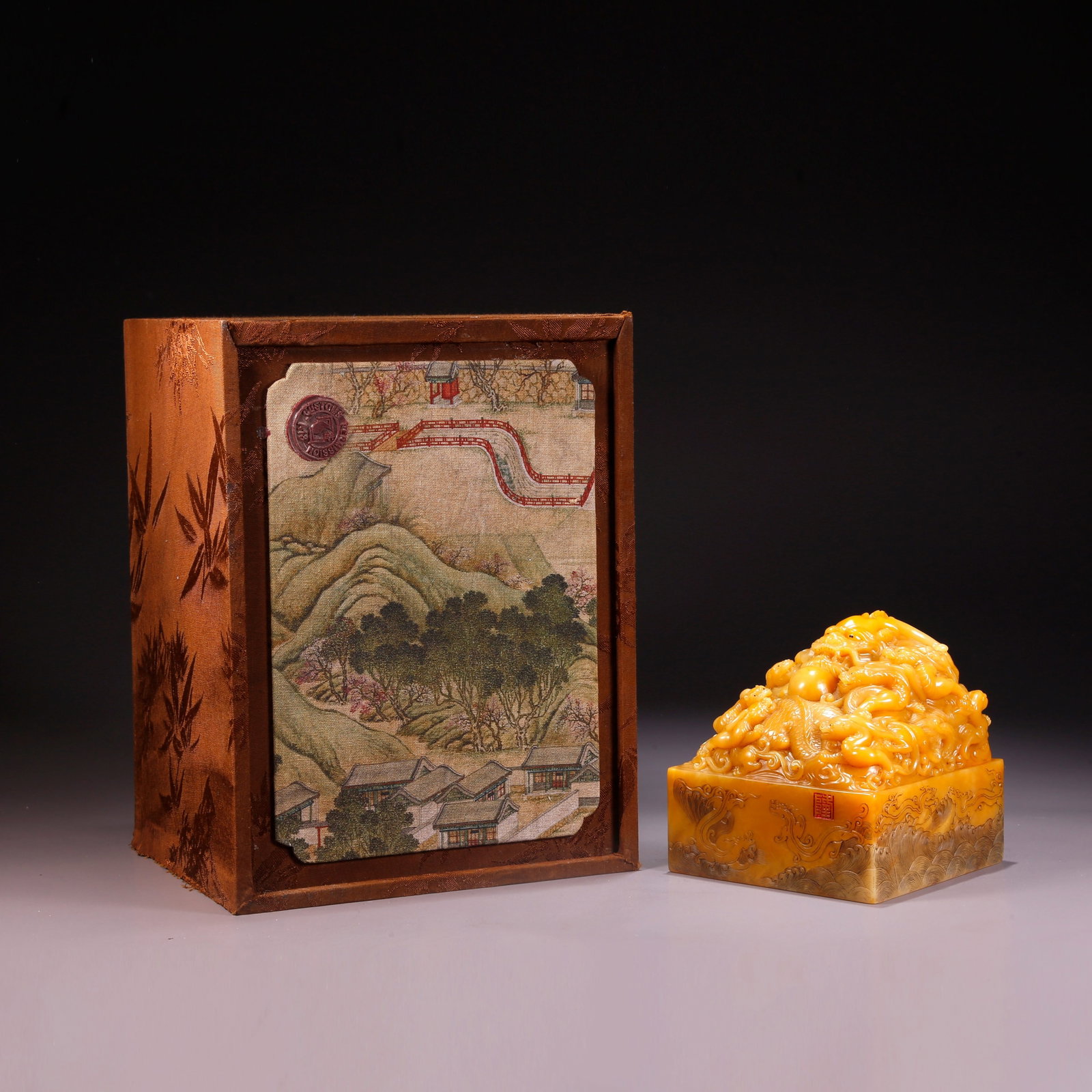 A SHOUSHAN TIANHUANG STONE NINE-DRAGON PATTERN SEAL (1 of 10)