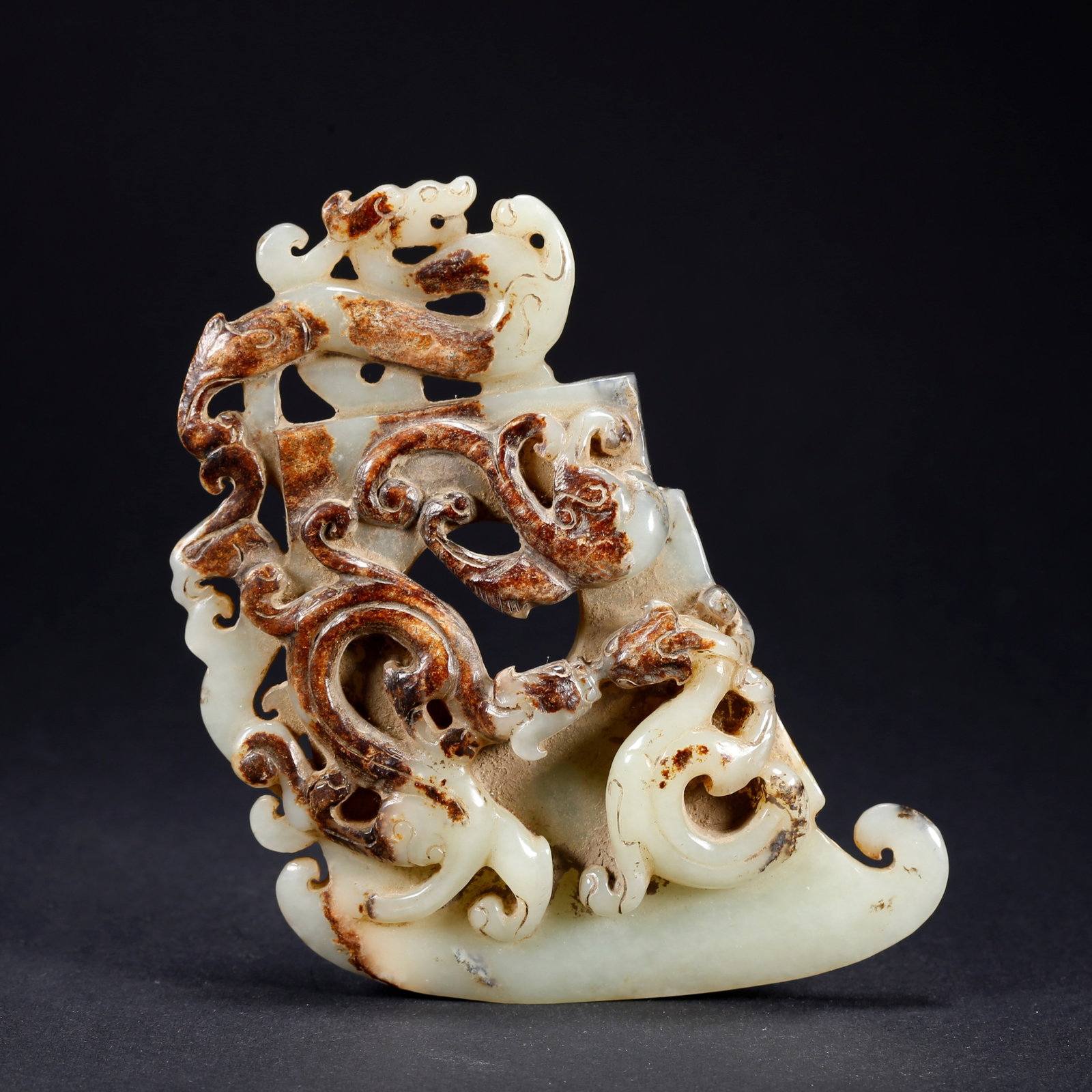 A HETIAN JADE DRAGON MOTIF AXE (1 of 10)