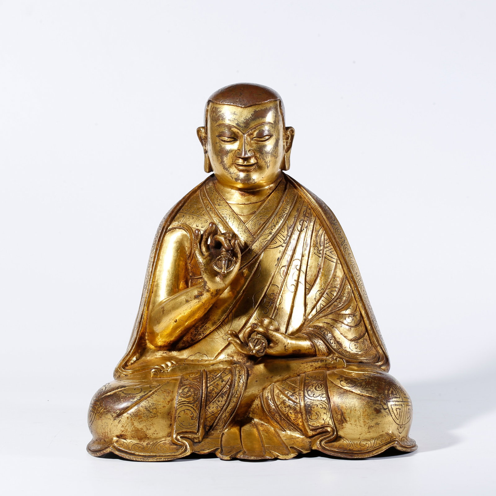 A GILDED BRONZE LAMA STATUE (1 of 9)