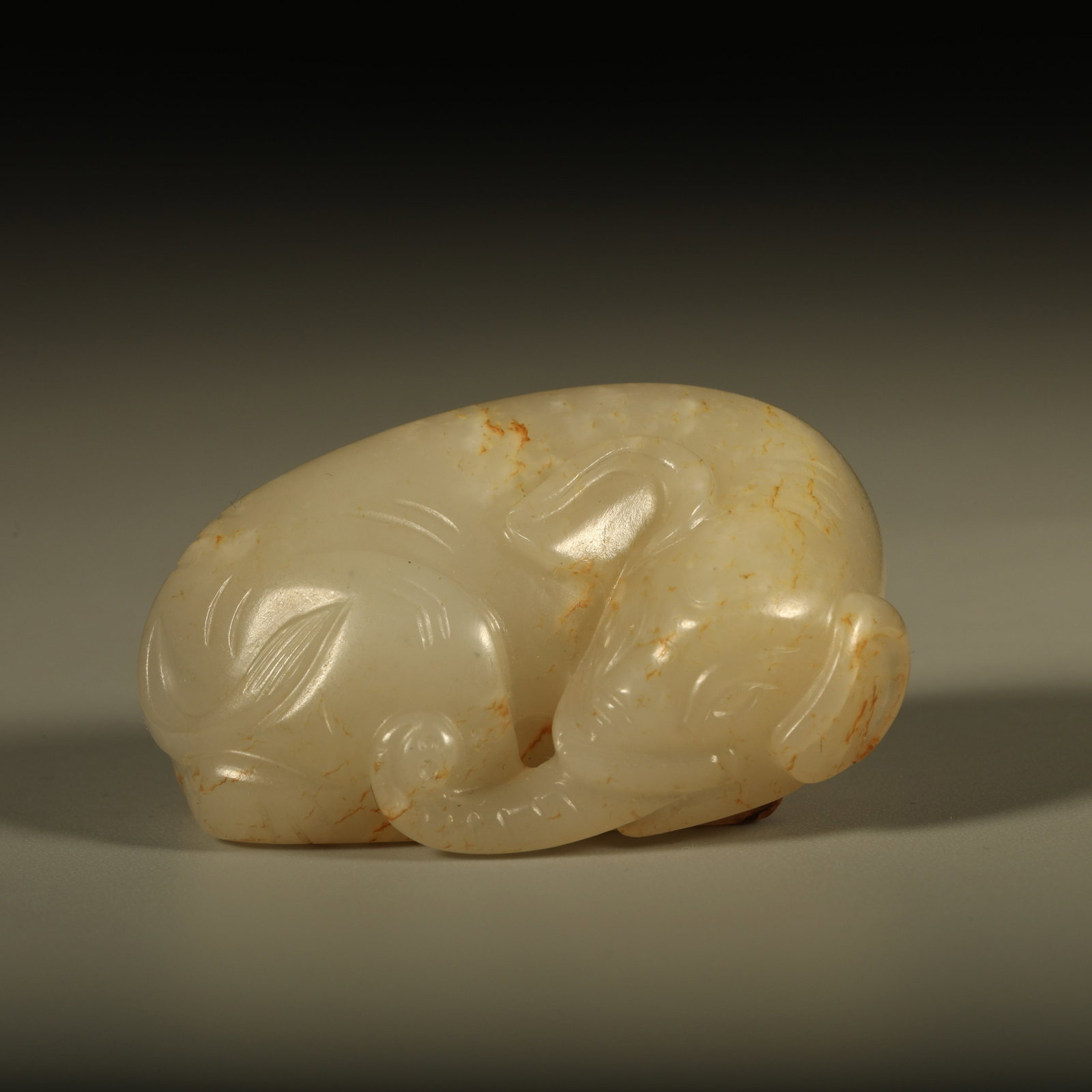 A HETIAN JADE PENDANT CARVED WITH PEACEFUL ELEPHANT MOTIF (1 of 6)
