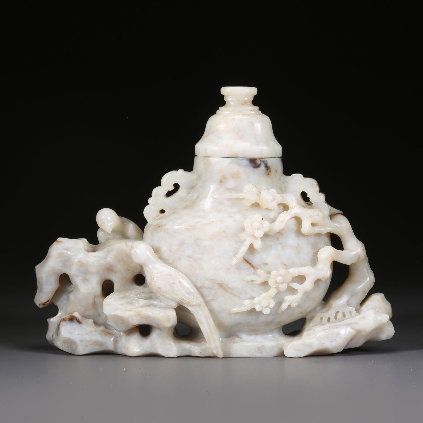A HETIAN JADE COVERED VASE WITH RIBBON-AND-BIRD MOTIF: Hetian jade covered vase with ribbon-and-bird motif