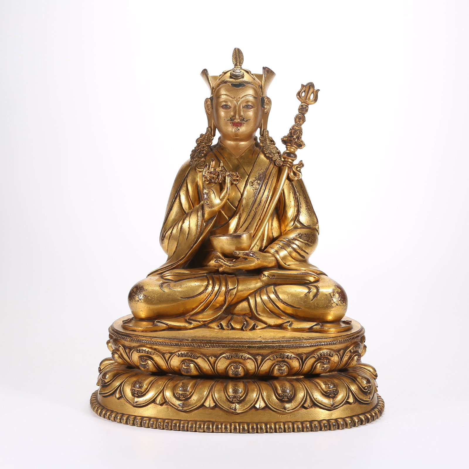A GILT-BRONZE STATUE OF PADMASAMBHAVA (GURU RINPOCHE): Gilt-Bronze Statue of Padmasambhava (Guru Rinpoche)