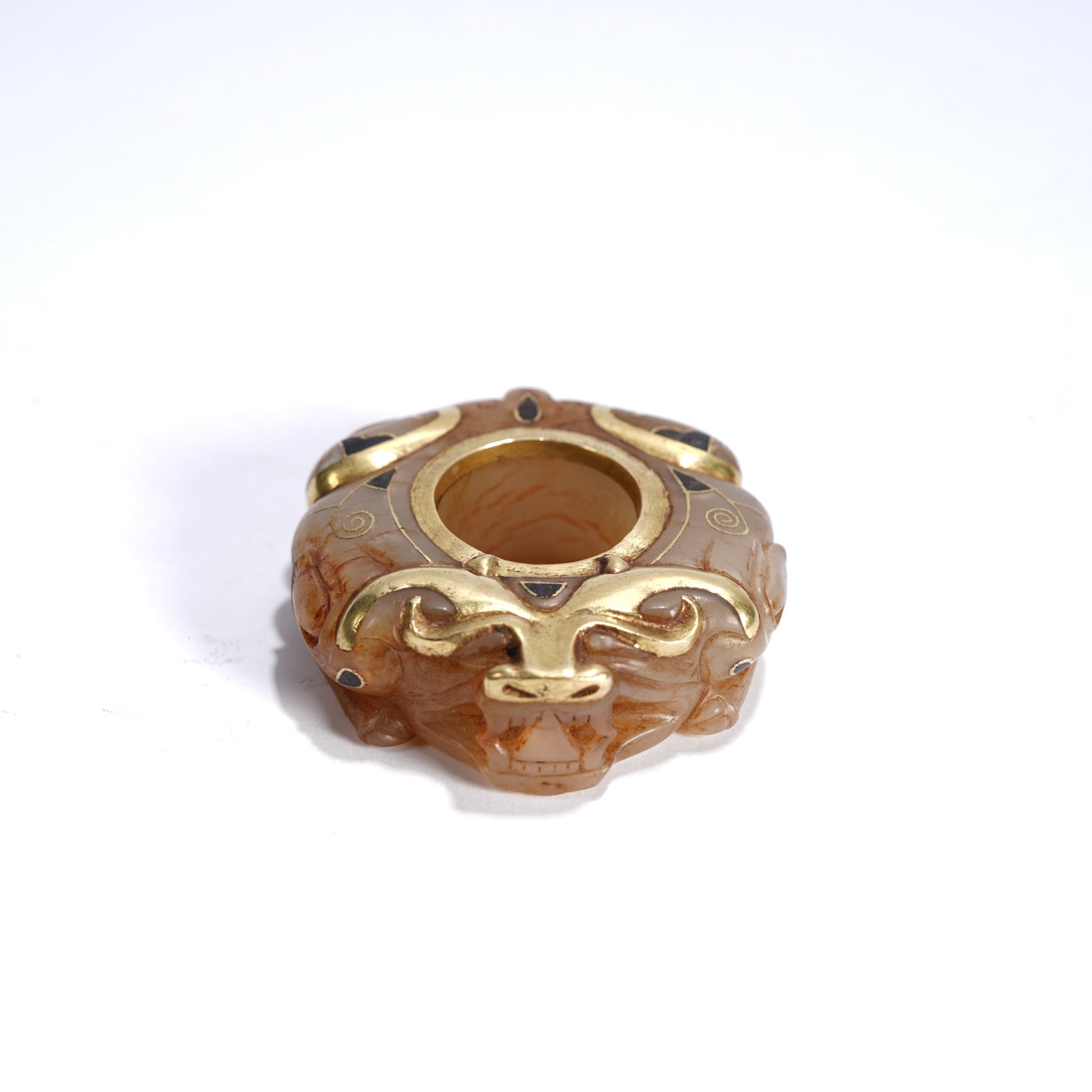 A ANCIENT JADE GILT-INLAID BEAST-HEAD "CHICKEN-HEART" PENDANT: Ancient jade gilt-inlaid beast-head "chicken-heart" pendant