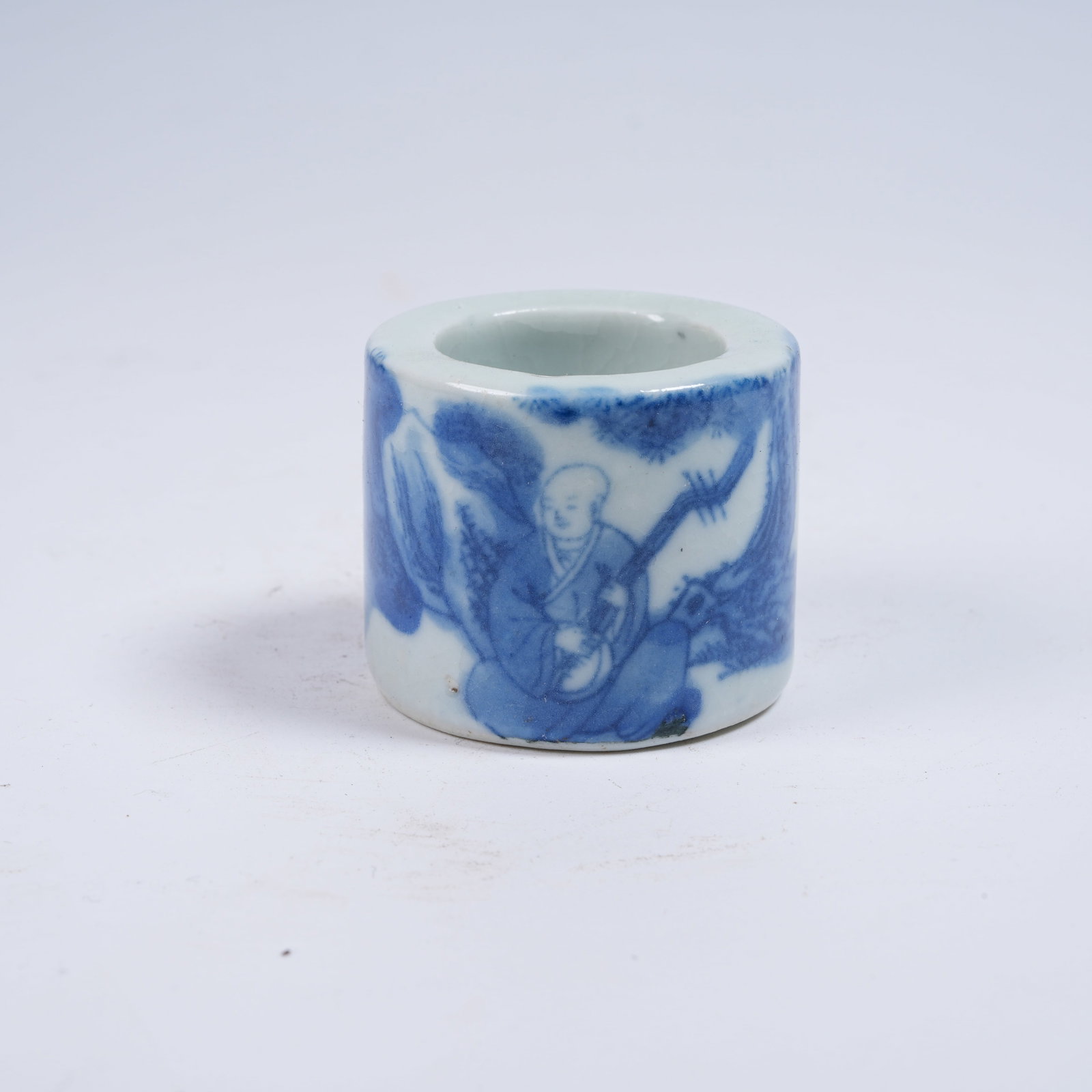 A BLUE AND WHITE THUMB RING WITH ARHAT PATTERN: Blue and White Thumb Ring with Arhat Pattern