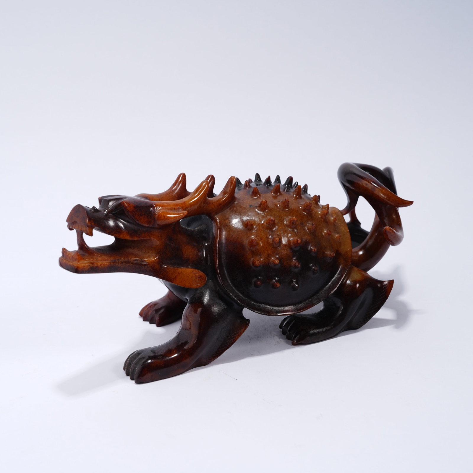 A ANCIENT JADE DRAGON-TURTLE WITH NIPPLE-AND-GROOVE PATTERN ORNAMENT (1 of 9)