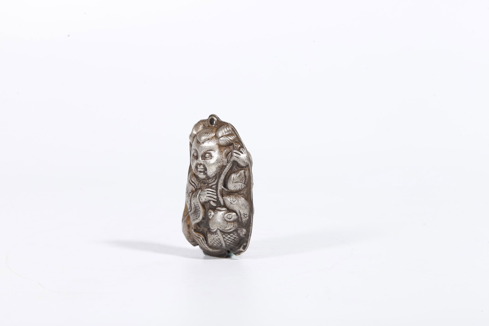 A SILVER BOY PATTERN PENDANT - 2