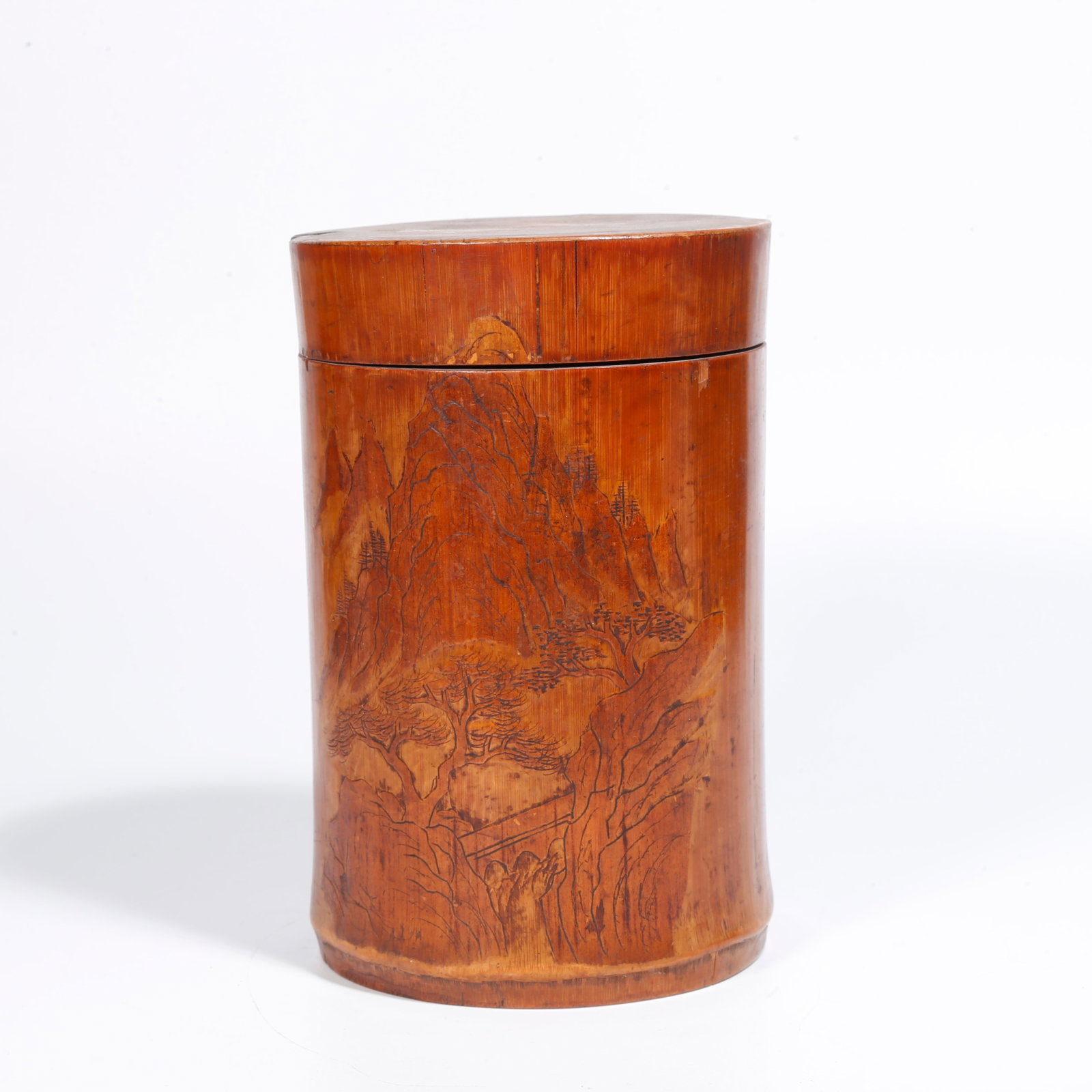 A BAMBOO CARVED LANDSCAPE PATTERN COVERED CYLINDER: Bamboo Carved Landscape Pattern Covered Cylinder