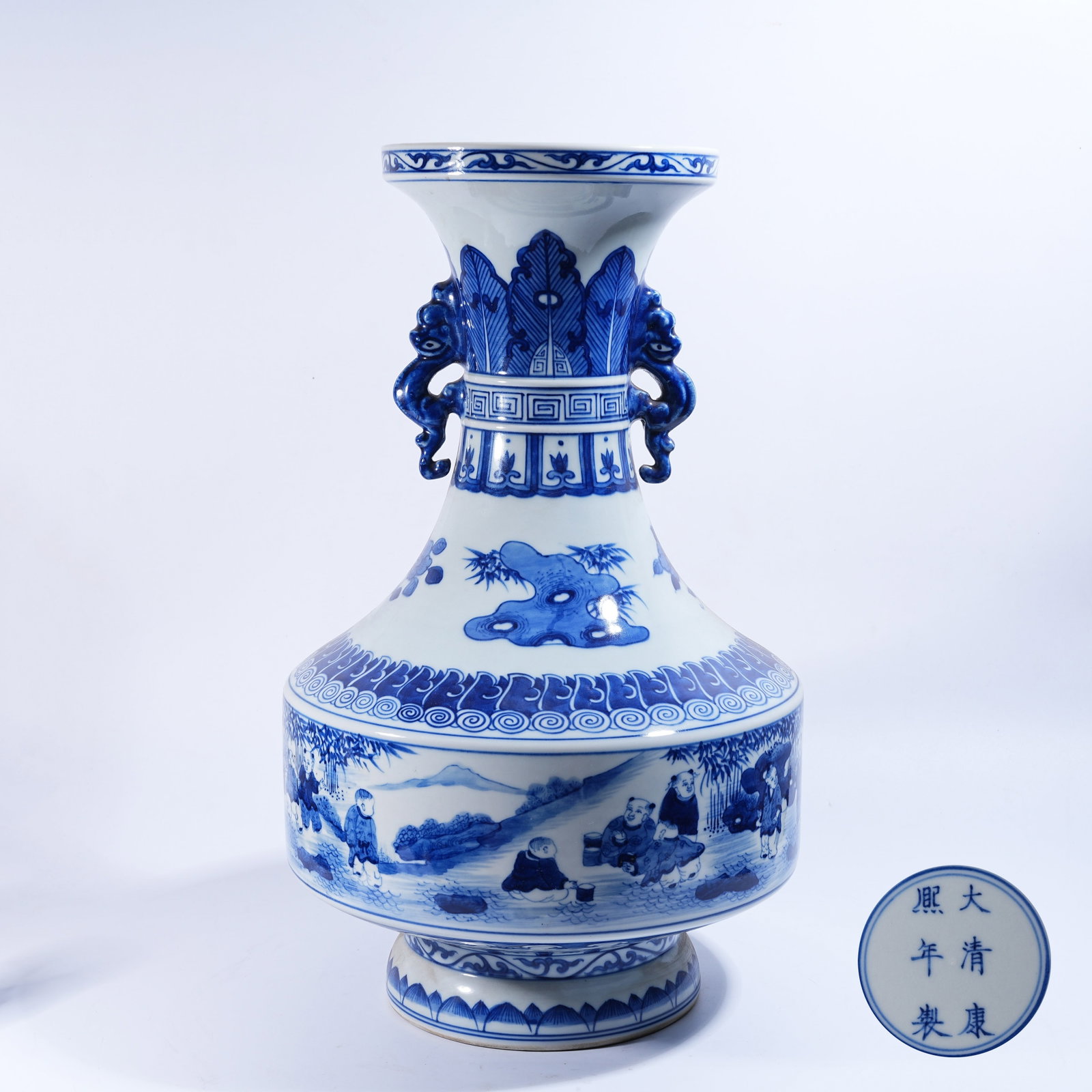 A BLUE AND WHITE DRAGON-EARED ZUN VASE WITH COURTYARD FIGURE STORY PATTERN: Blue and White Dragon-eared Zun Vase with Courtyard Figure Story Pattern