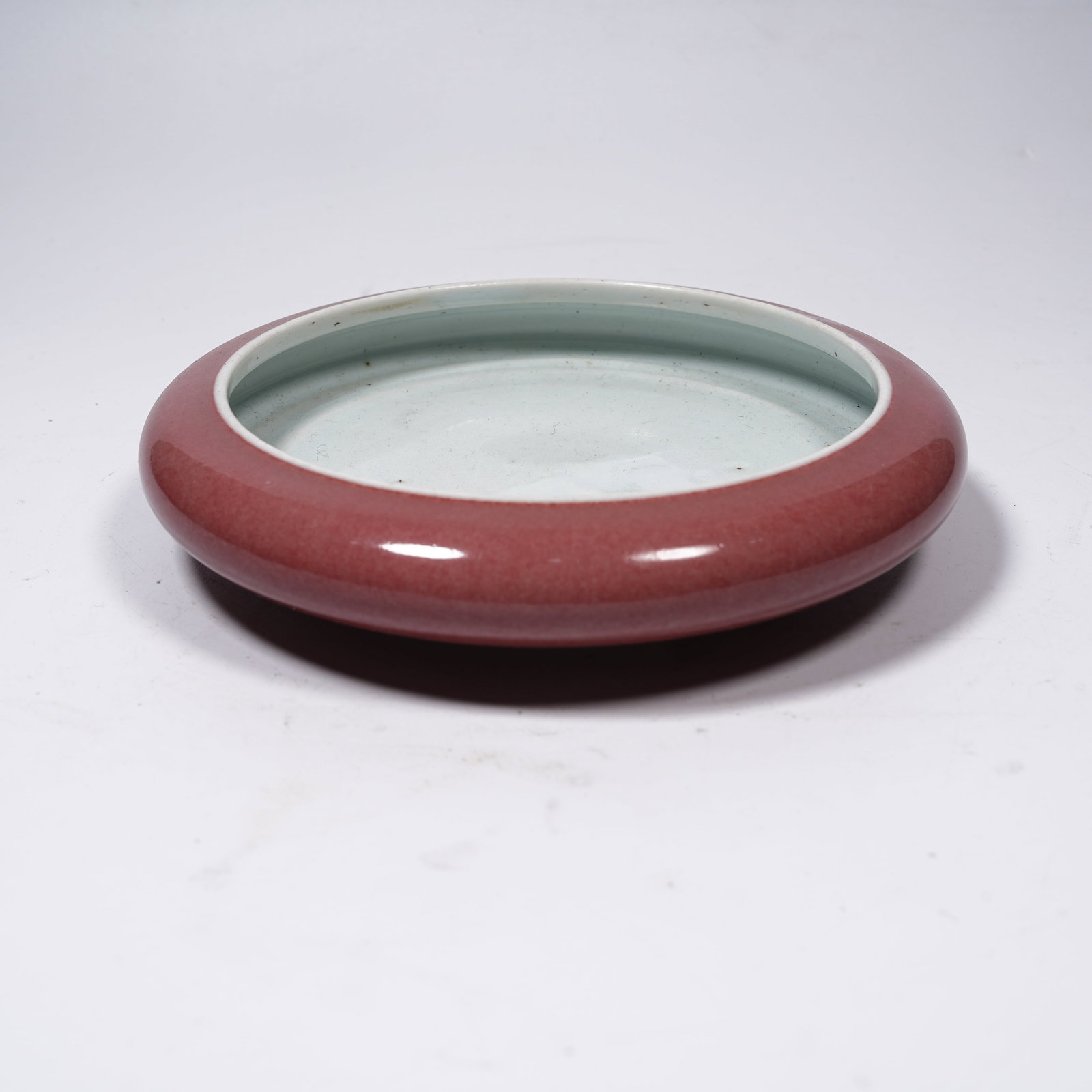 A RED GLAZE GONG-SHAPED WASHER (1 of 8)